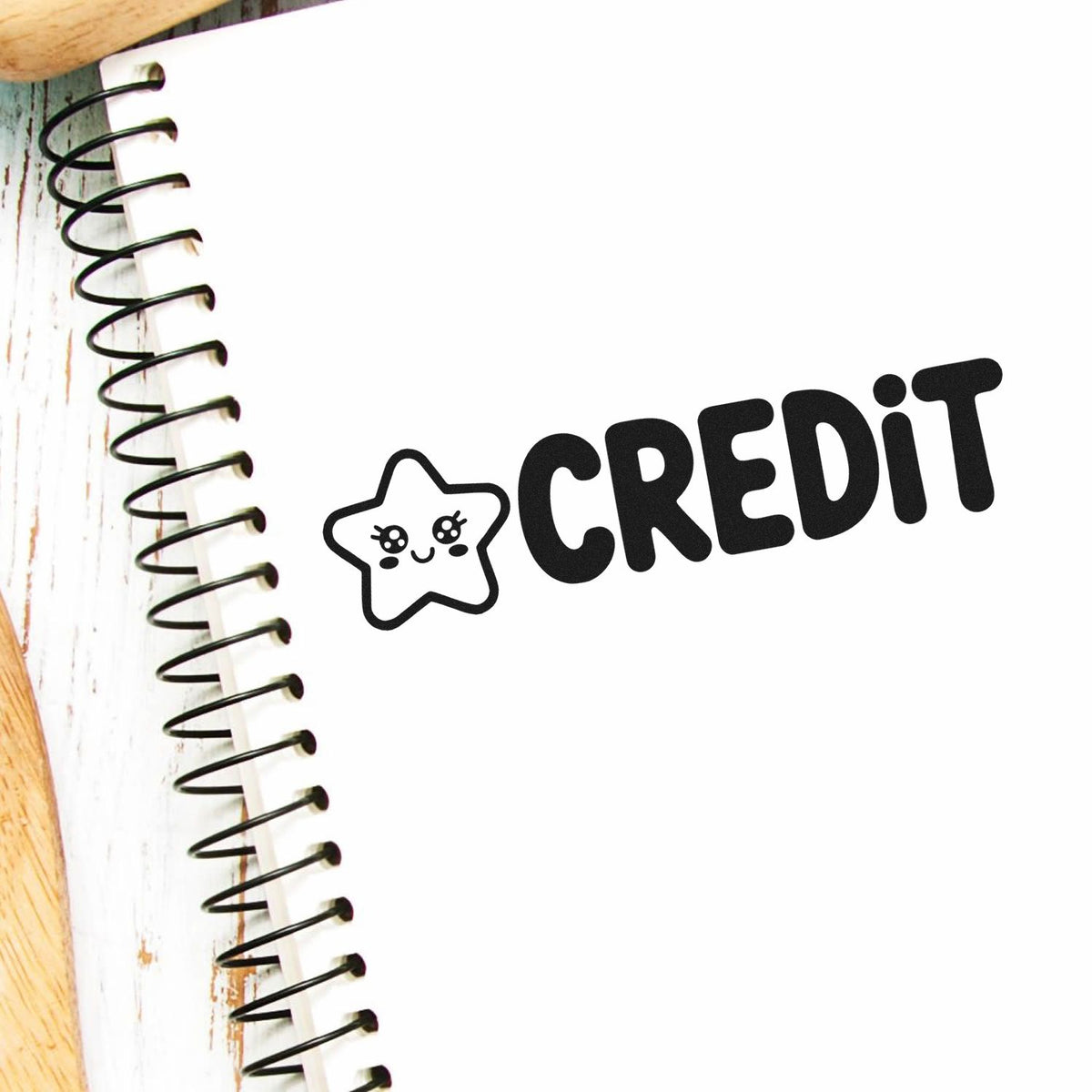 Cute CREDIT rubber stamp with star icon on notebook page, perfect for teacher feedback, planners, and scrapbooking.