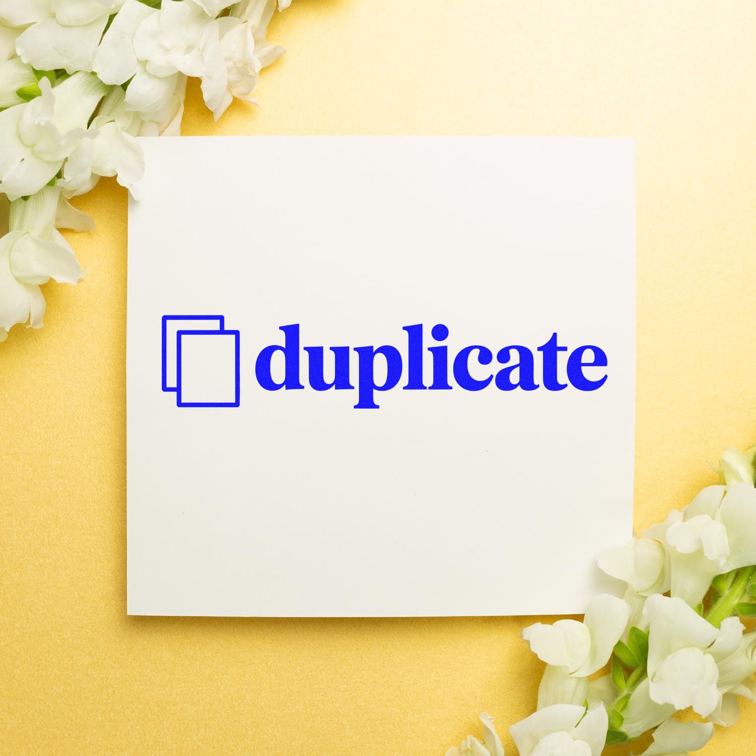 Duplicate rubber stamp with blue icon on white card, ideal for office document marking and copy labeling.