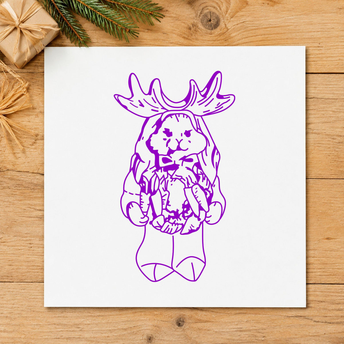 Bunny in Reindeer Costume Rubber Stamp impression in purple ink on white paper in a styled craft setting.