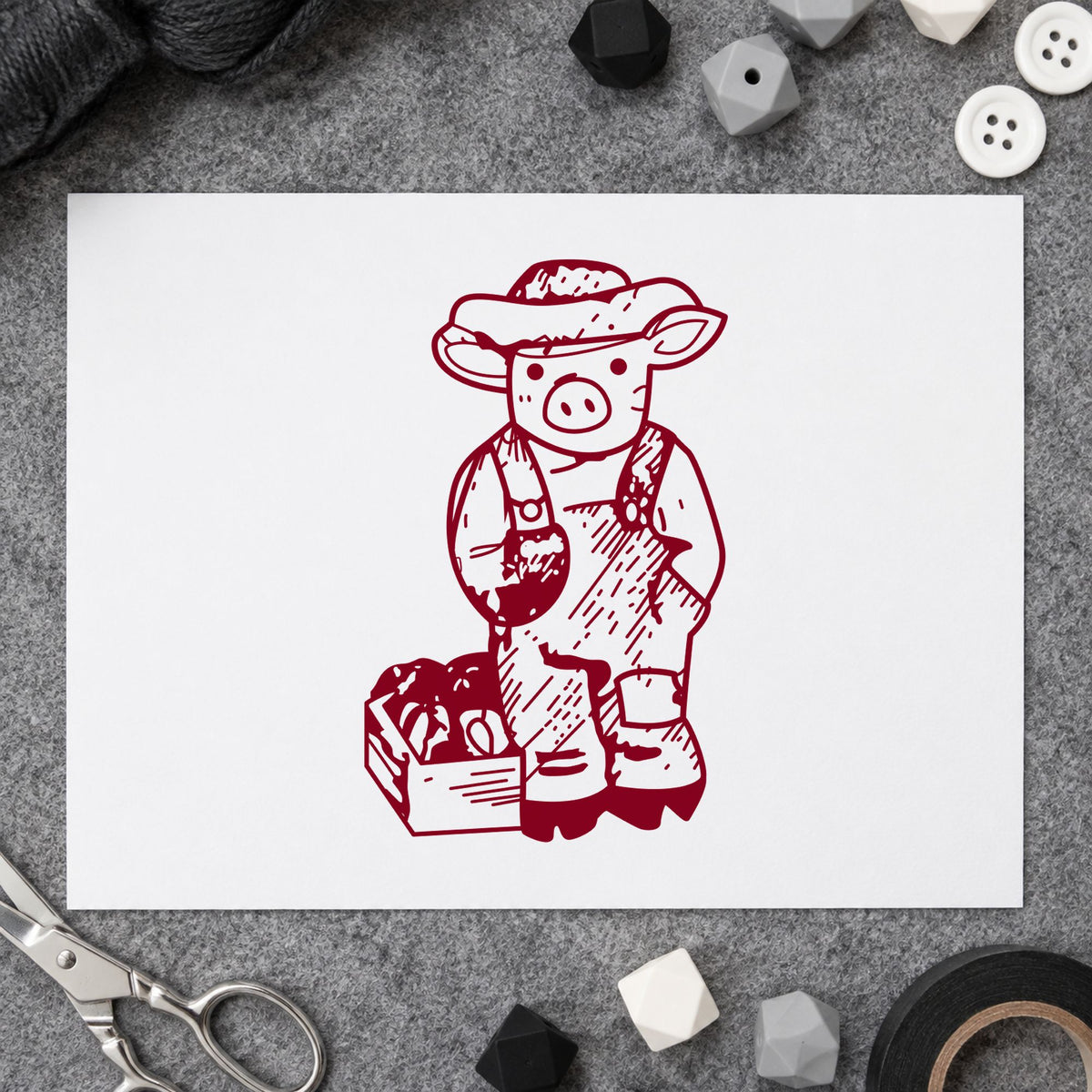 Farmer Pig with Produce Rubber Stamp impression in burgundy ink on white paper in a styled craft setting.