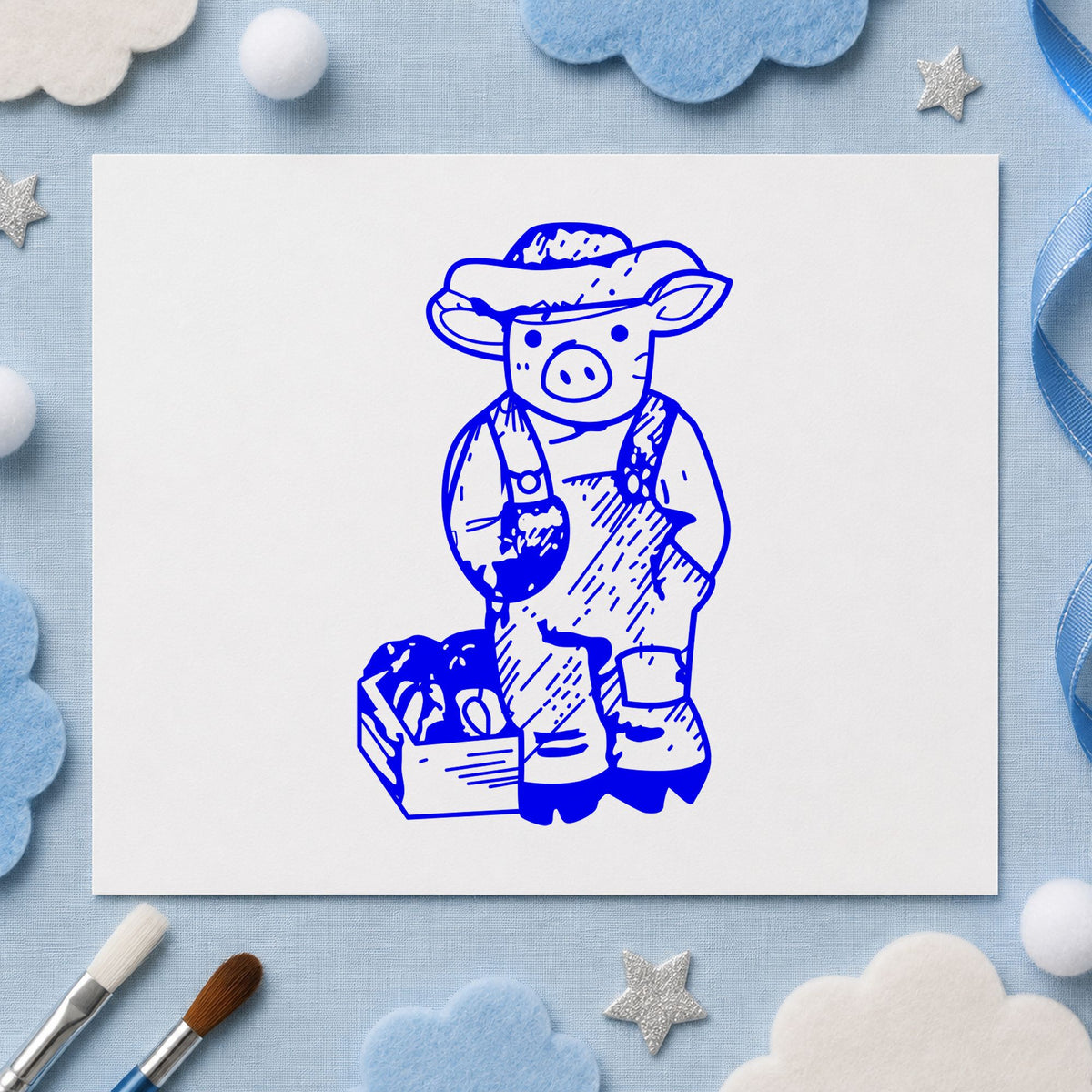 Blue farm craft stamp impression featuring the farmer pig with produce design on white paper.