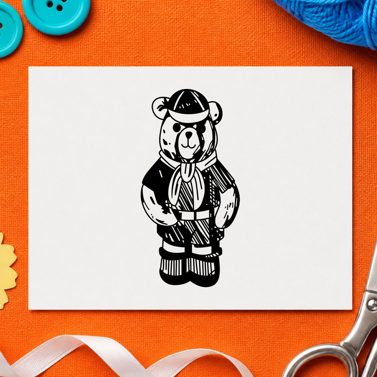 Black impression from a scouting bear stamp, featuring the cub scout bear in uniform design on white paper.