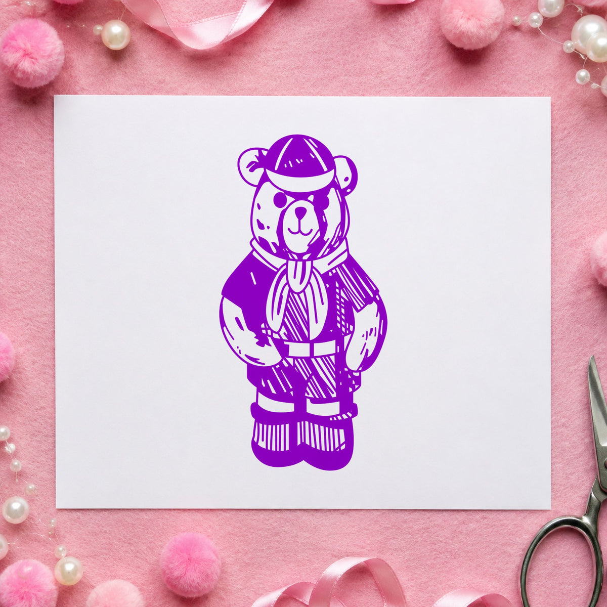 Cub Scout Bear in Uniform Rubber Stamp impression in purple ink on white paper in a styled craft setting.