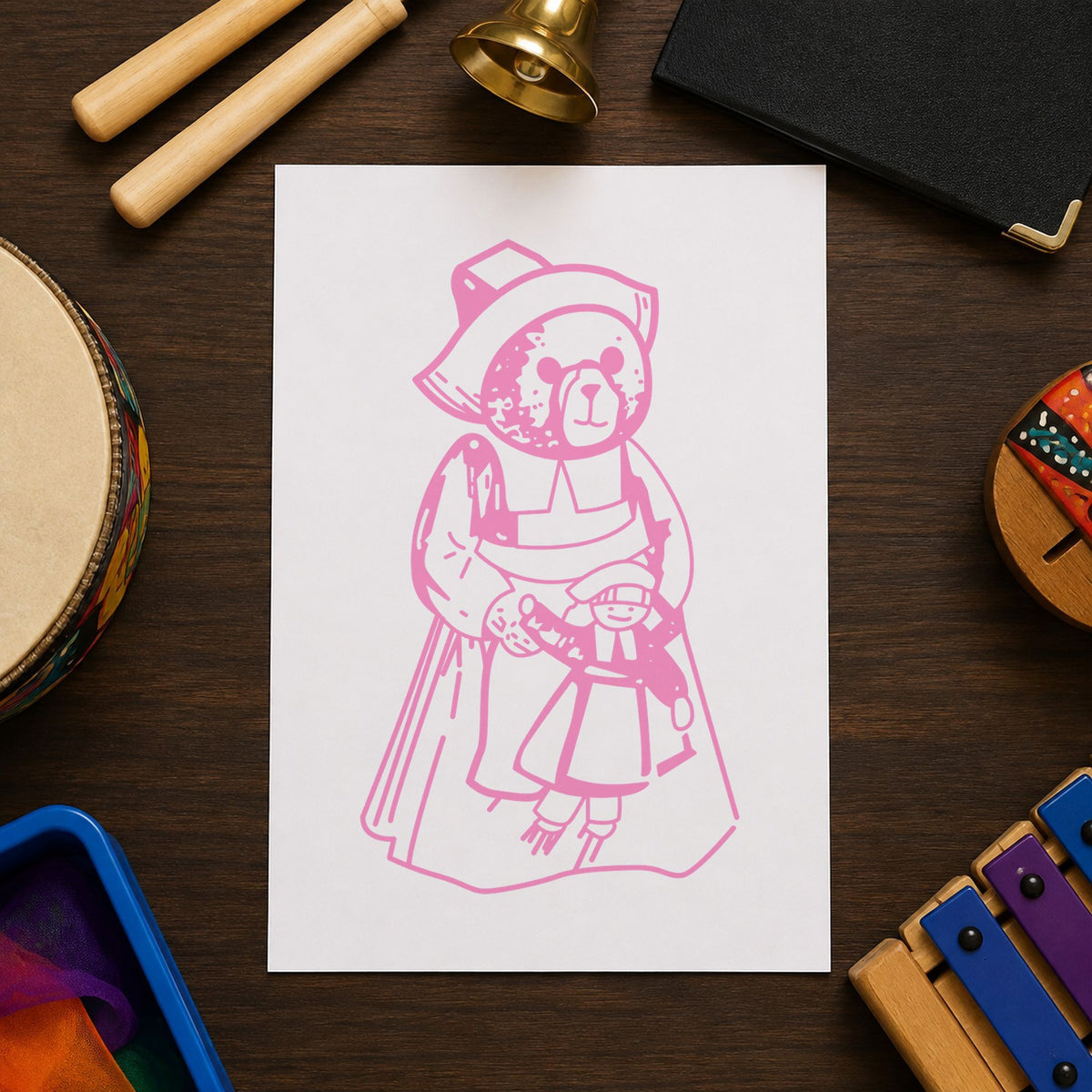 Girl Pilgrim Bear with Doll Rubber Stamp impression in pink ink on white paper in a styled craft setting.