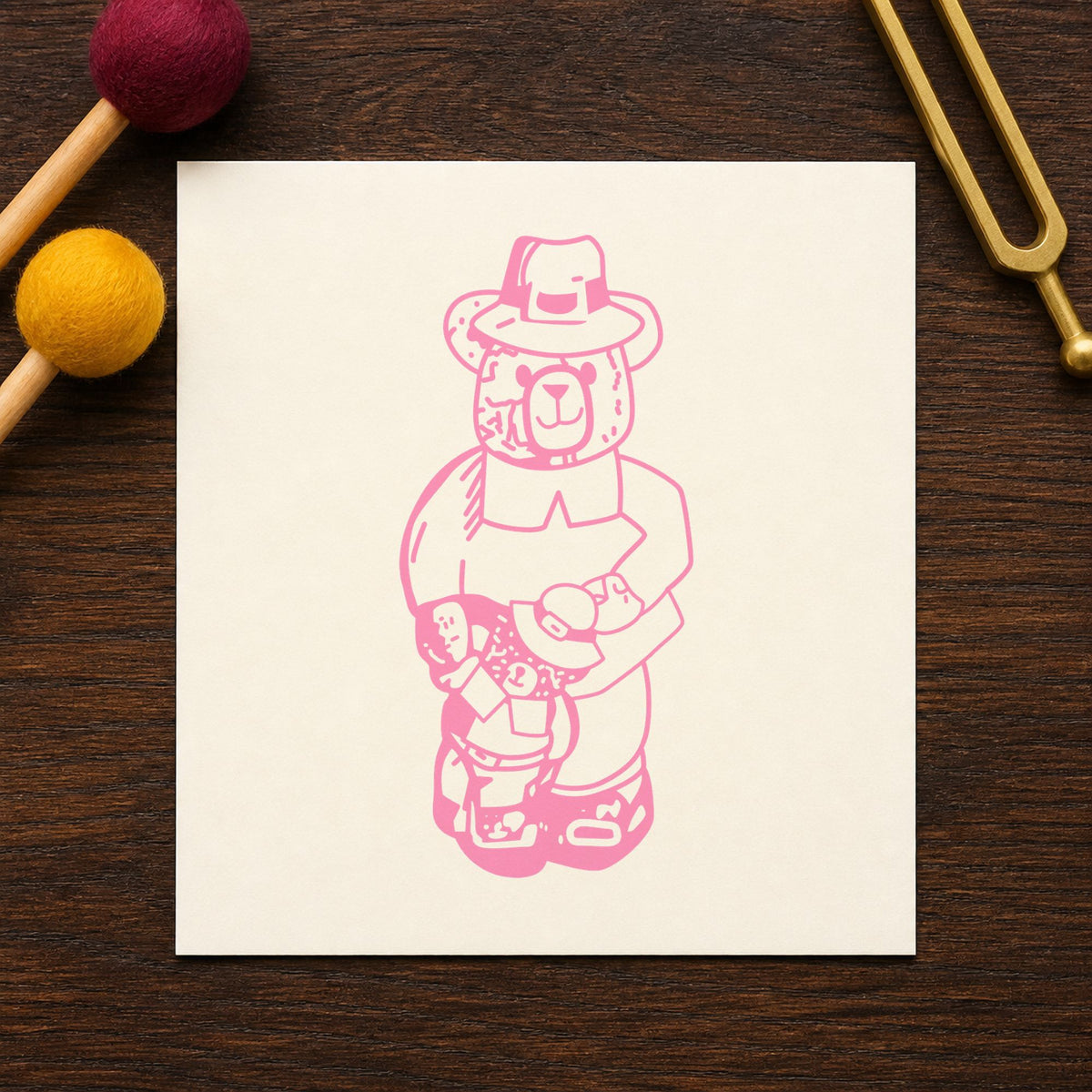 Boy Pilgrim Bear with Teddy Rubber Stamp impression in pink ink on white paper in a styled craft setting.