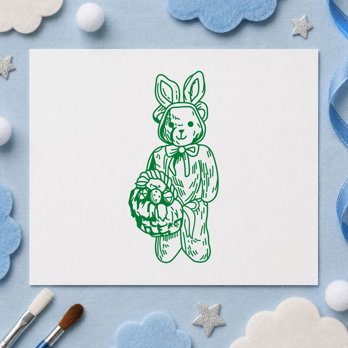 Bear in Bunny Costume with Basket Rubber Stamp impression in green ink on white paper in a styled craft setting.