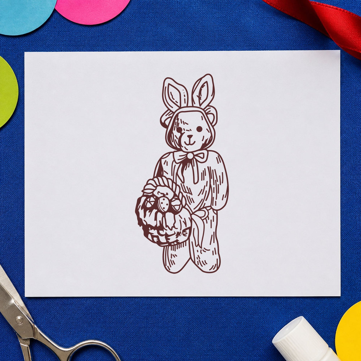 Bear in Bunny Costume with Basket Rubber Stamp impression in brown ink on white paper in a styled craft setting.