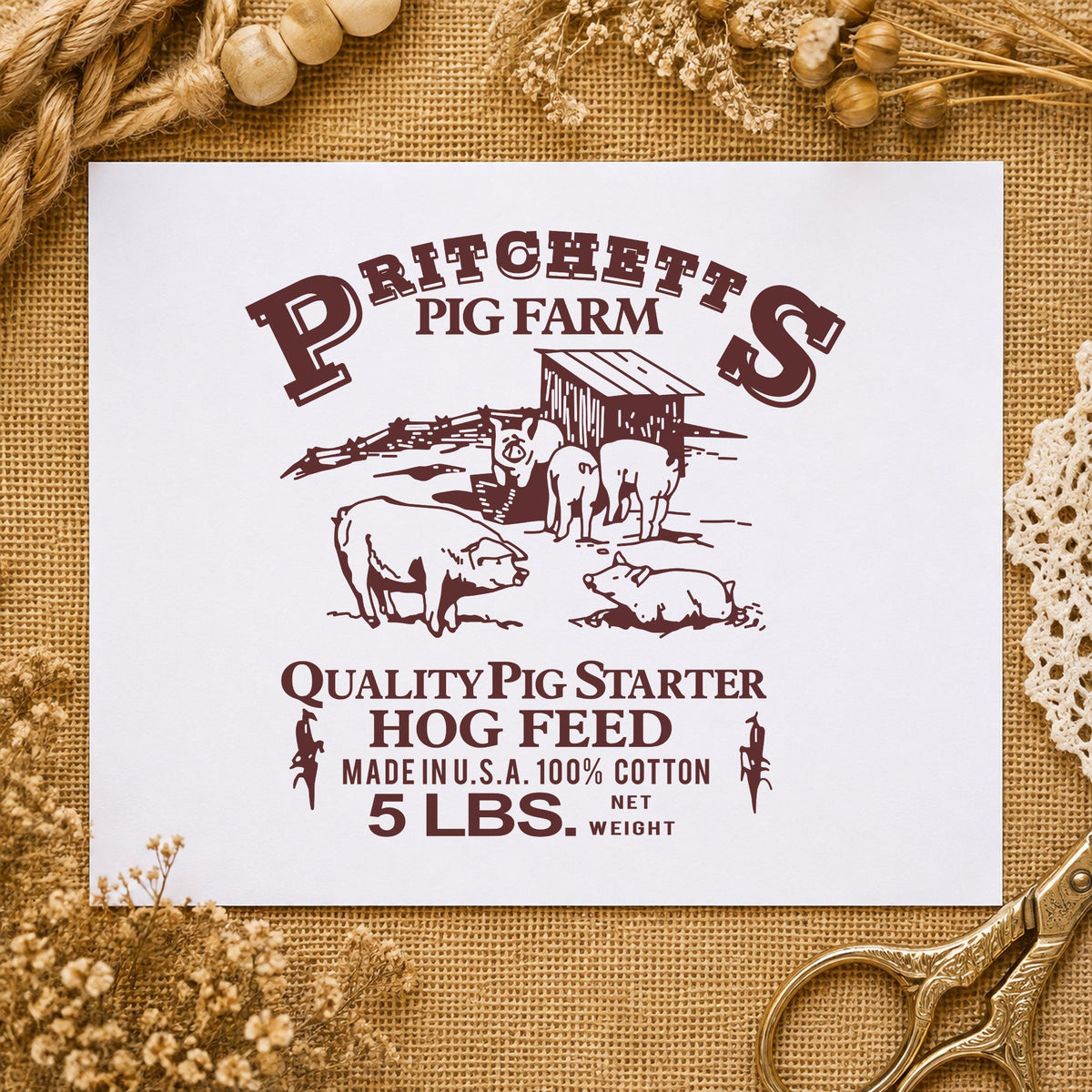 Hog Feed Label Rubber Stamp impression in brown ink on white paper in a styled craft setting.