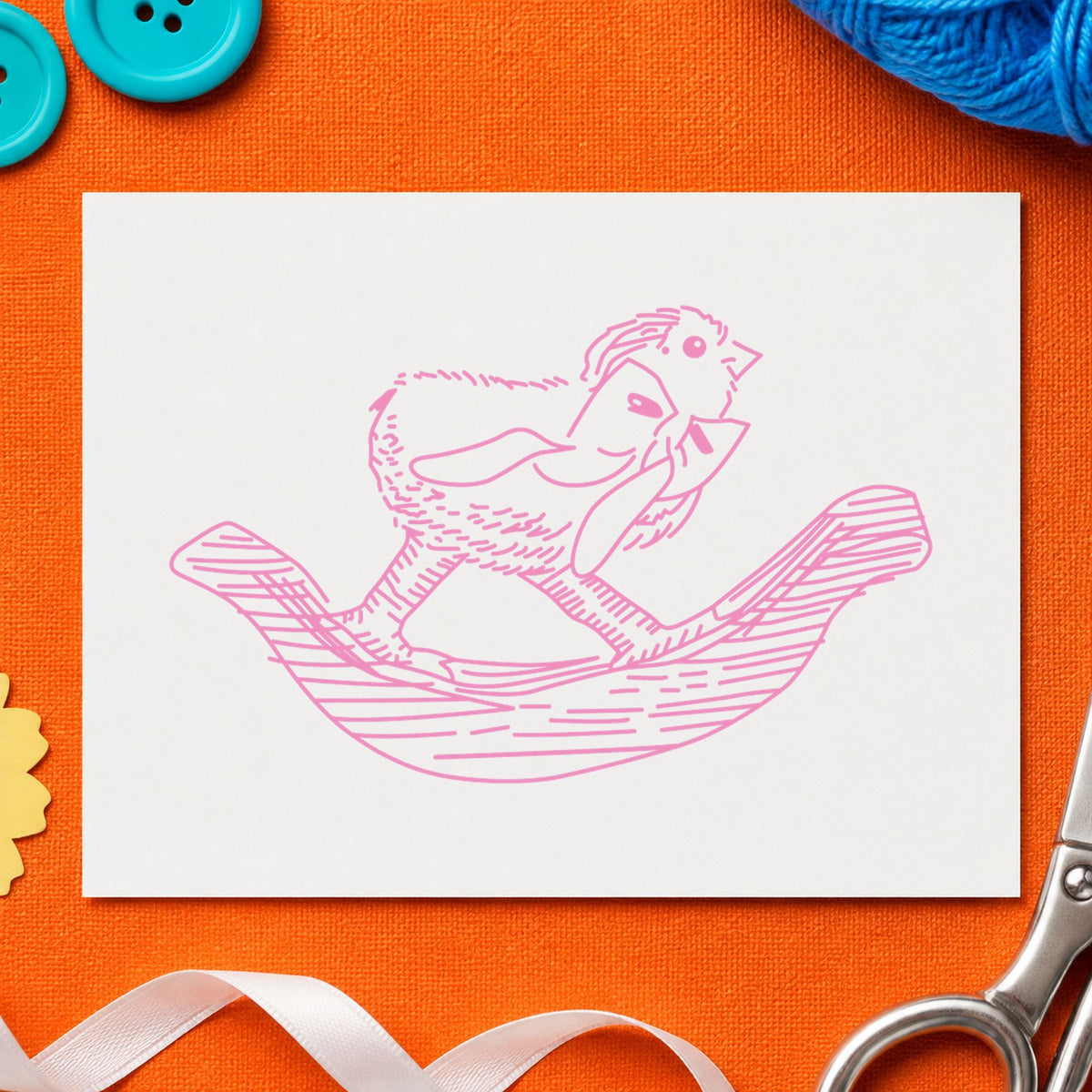 Rocking Chicken with Bow Rubber Stamp impression in pink ink on white paper in a styled craft setting.