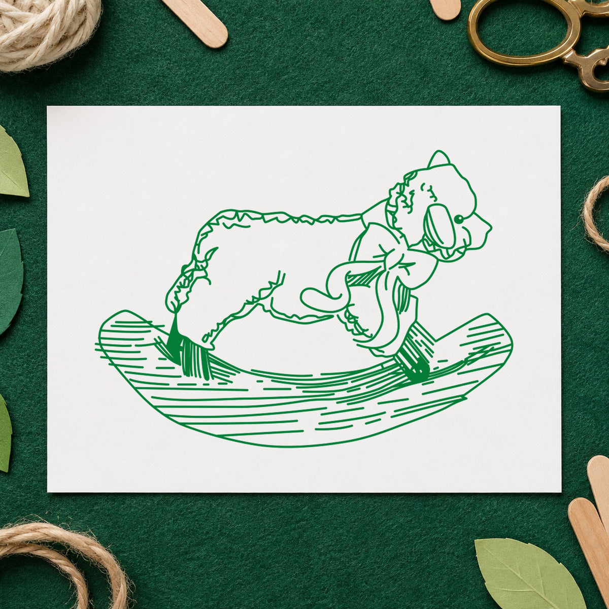 Rocking Sheep Rubber Stamp impression in green ink on white paper in a styled craft setting.