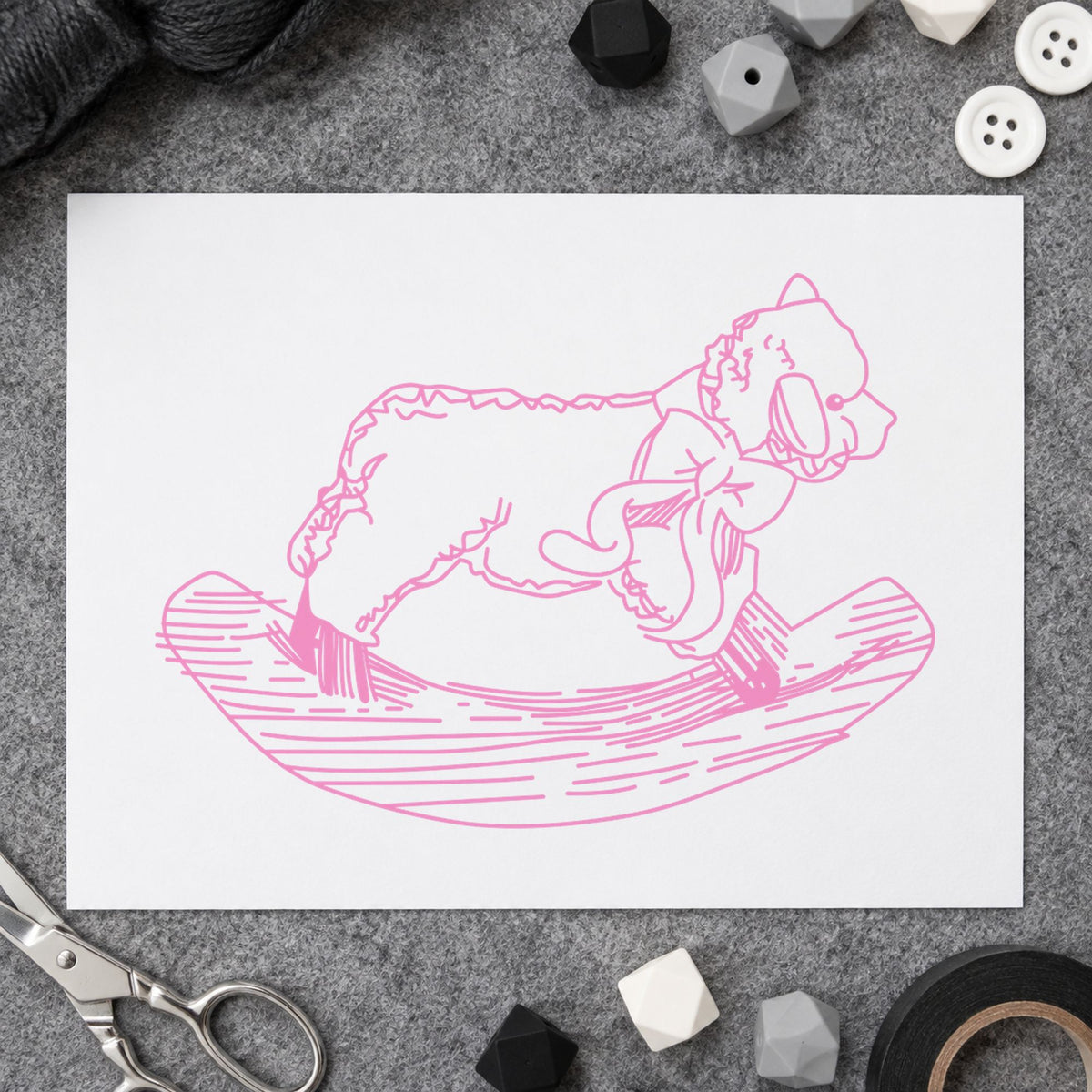 Rocking Sheep Rubber Stamp impression in pink ink on white paper in a styled craft setting.