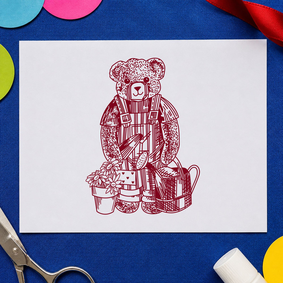 Teddy Bear Riding Rocking Horse Rubber Stamp impression in burgundy ink on white paper in a styled craft setting.