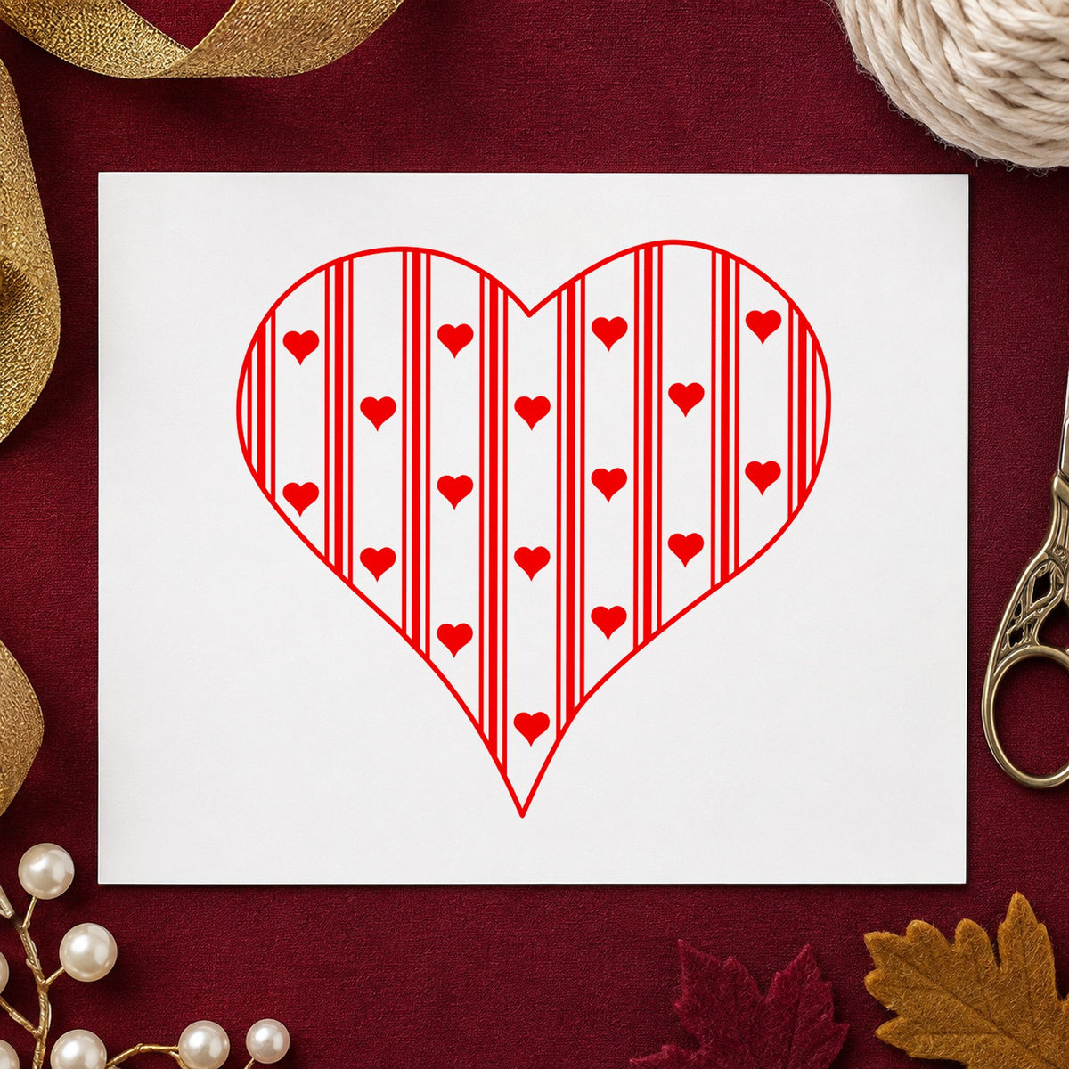 Striped Country Heart Rubber Stamp impression in red ink on white paper in a styled craft setting.