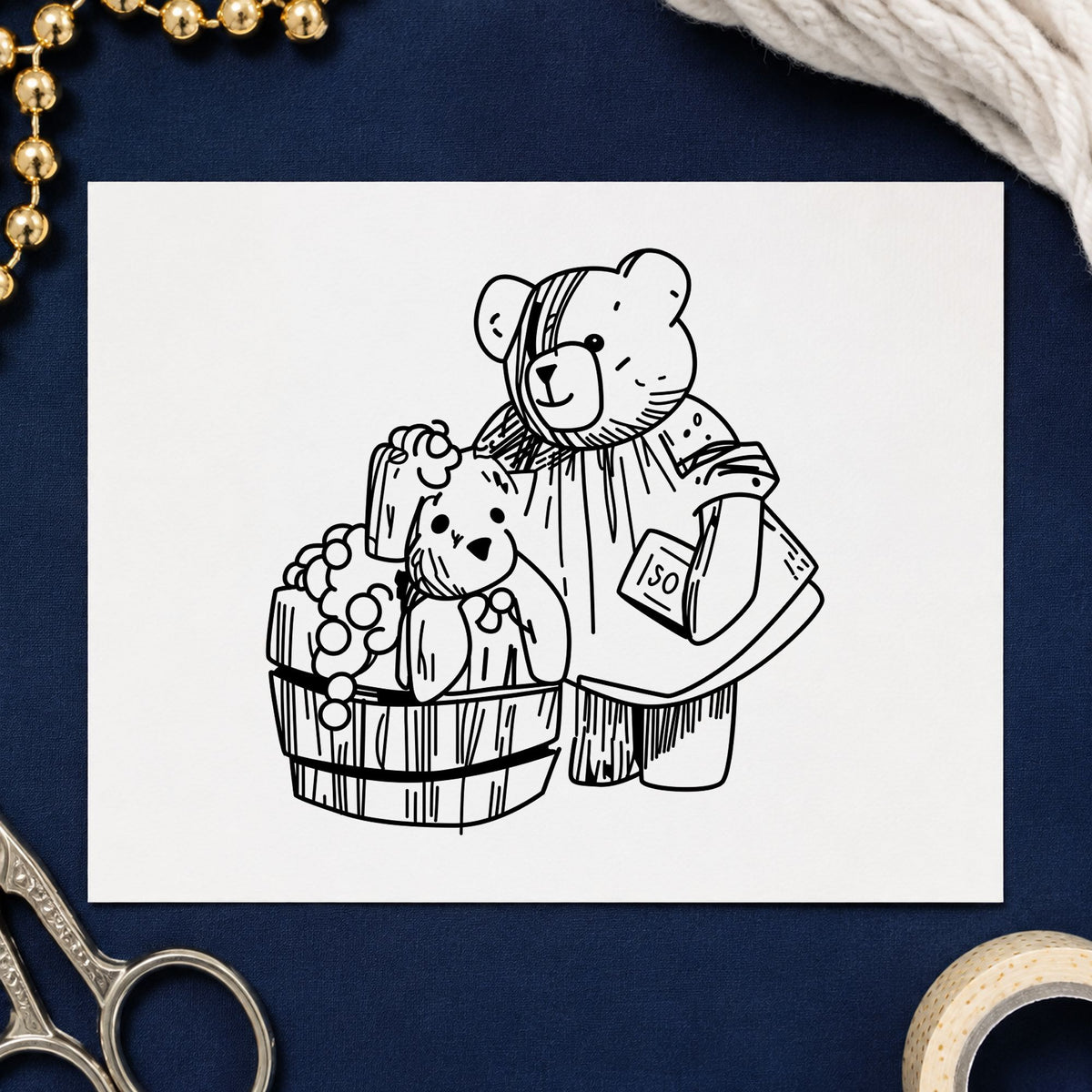 Black impression from a teddy bear rubber stamp, featuring the bear washing teddy in barrel design on white paper.
