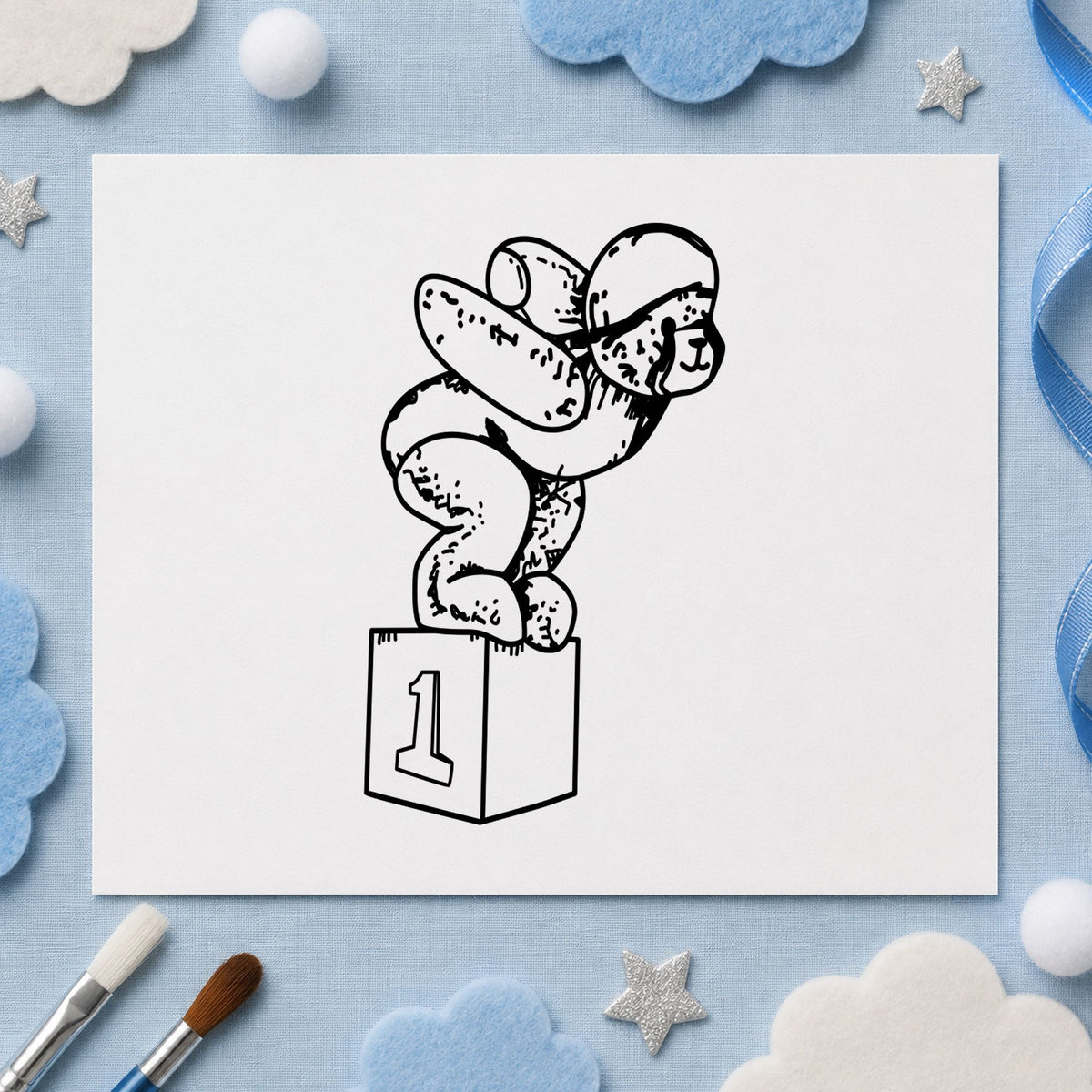 Black impression from a swimming rubber stamp, featuring the diving bear on starting block design on white paper.