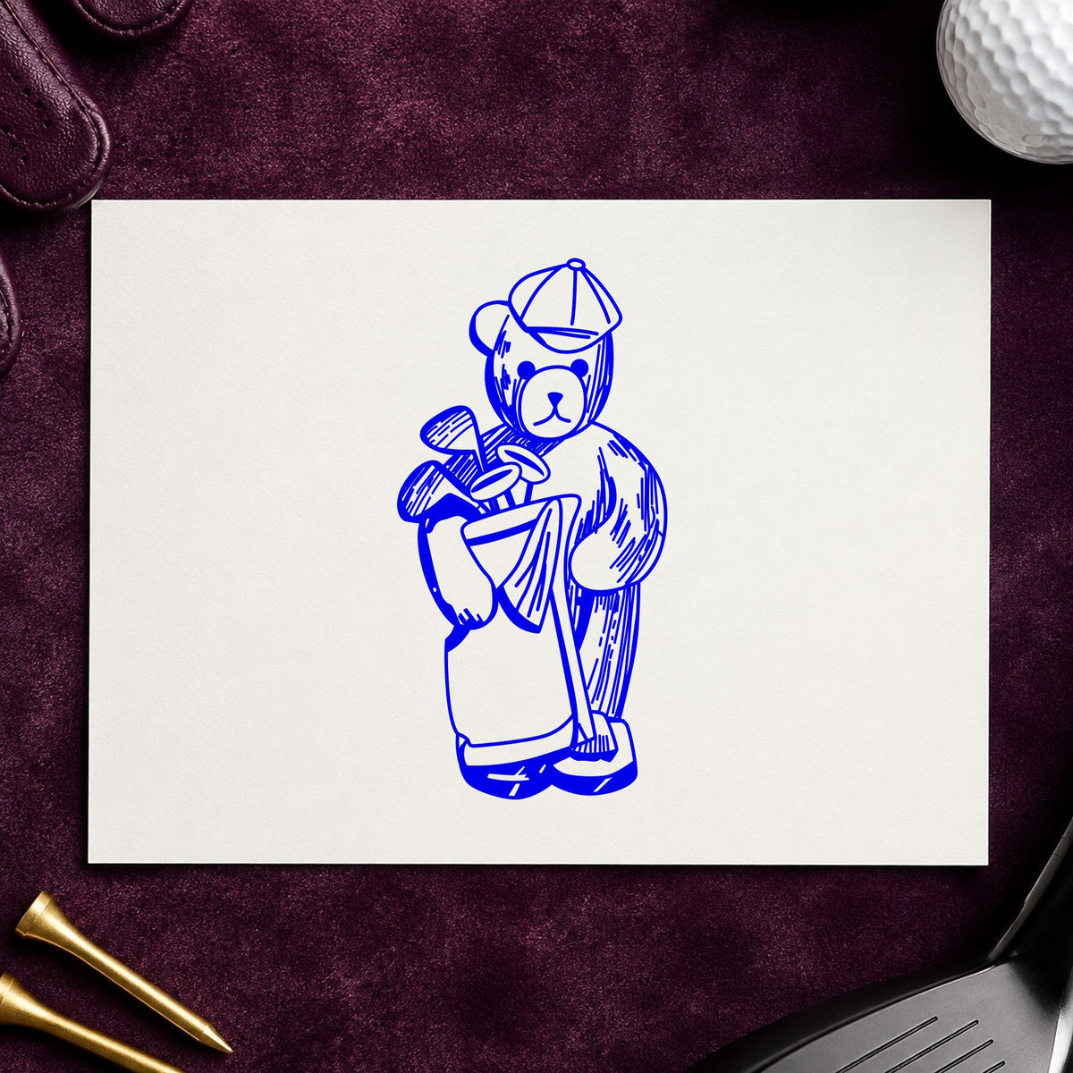 Blue sports craft stamp impression featuring the golf bear with clubs design on white paper.