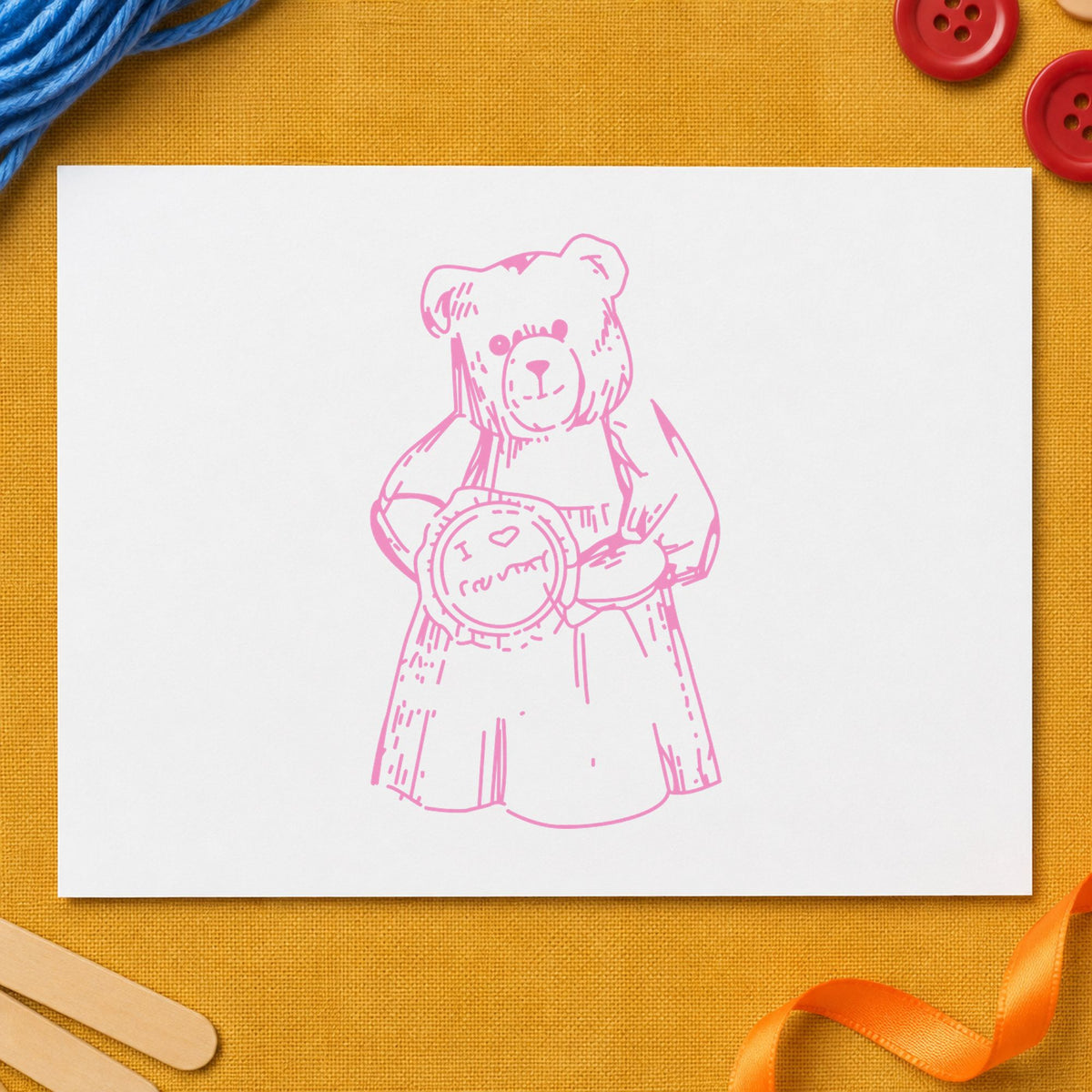 I Love Country Bear with Pie Rubber Stamp impression in pink ink on white paper in a styled craft setting.