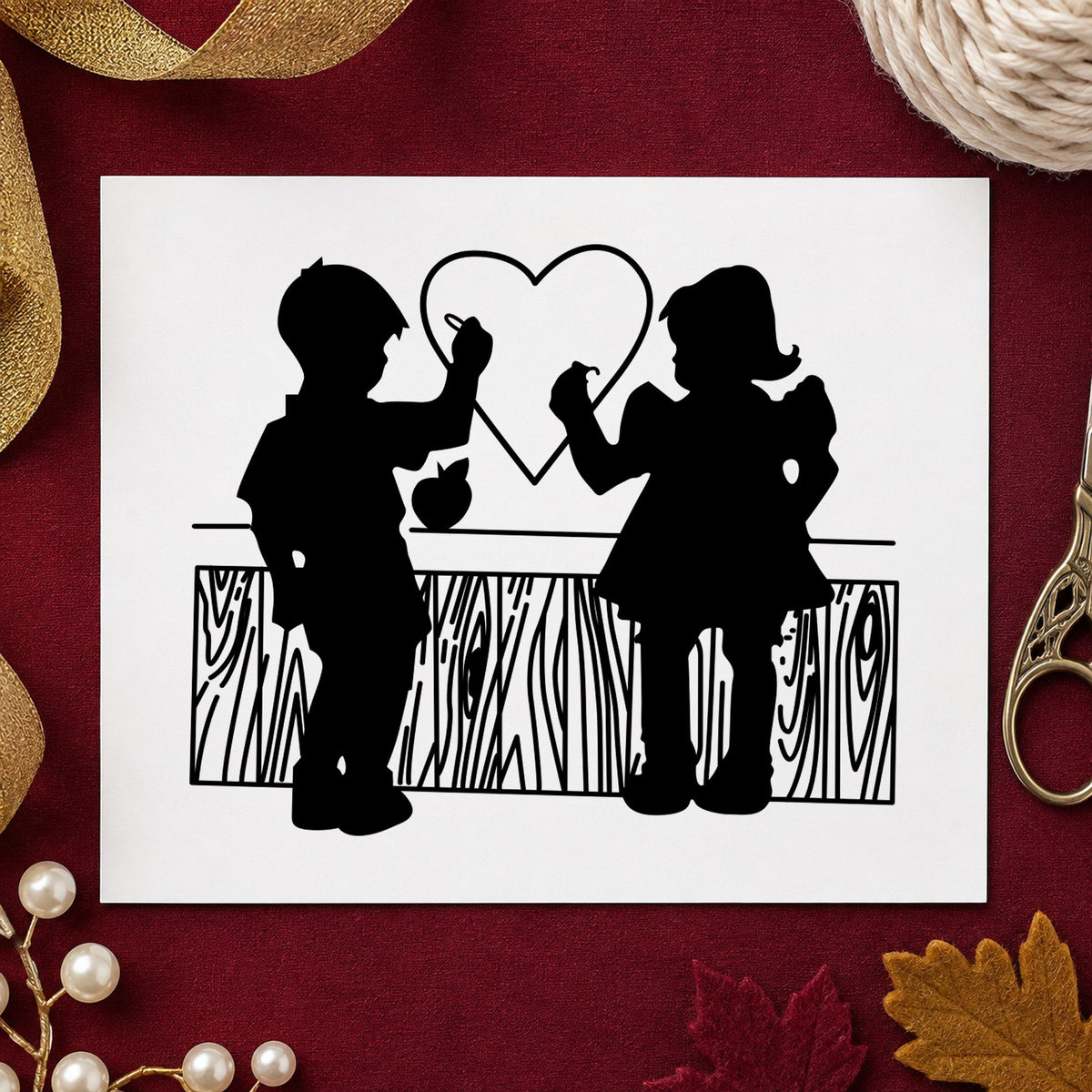 Boy and Girl Drawing a Heart Rubber Stamp impression in black ink on white paper in a styled craft setting.