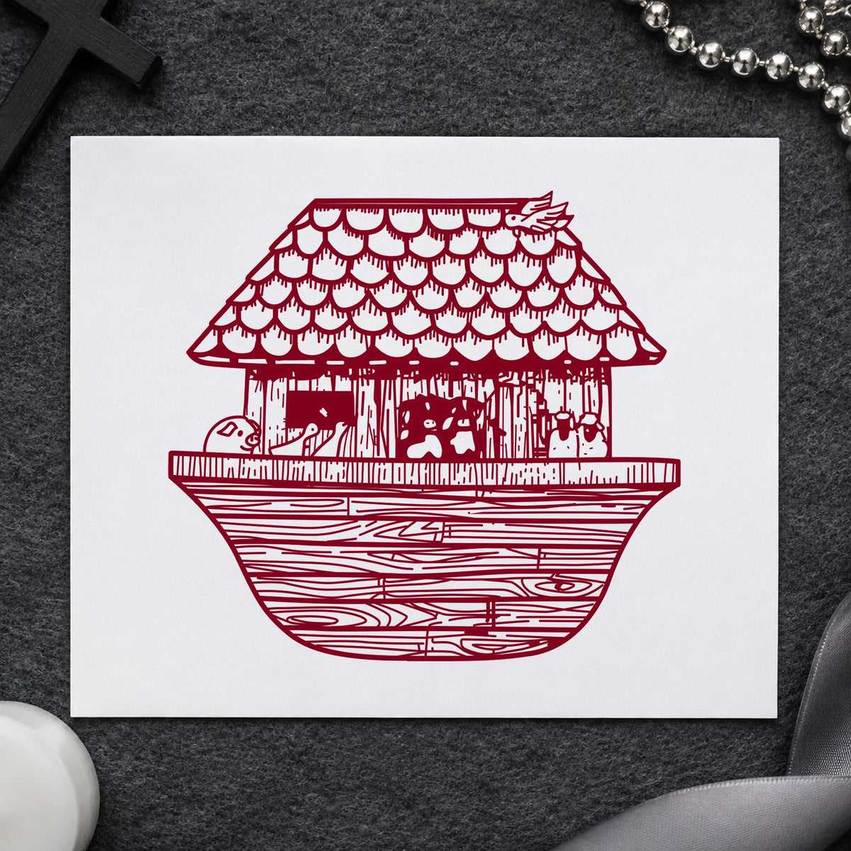 Noah's Ark Rubber Stamp Wide impression in burgundy ink on white paper in a styled craft setting.