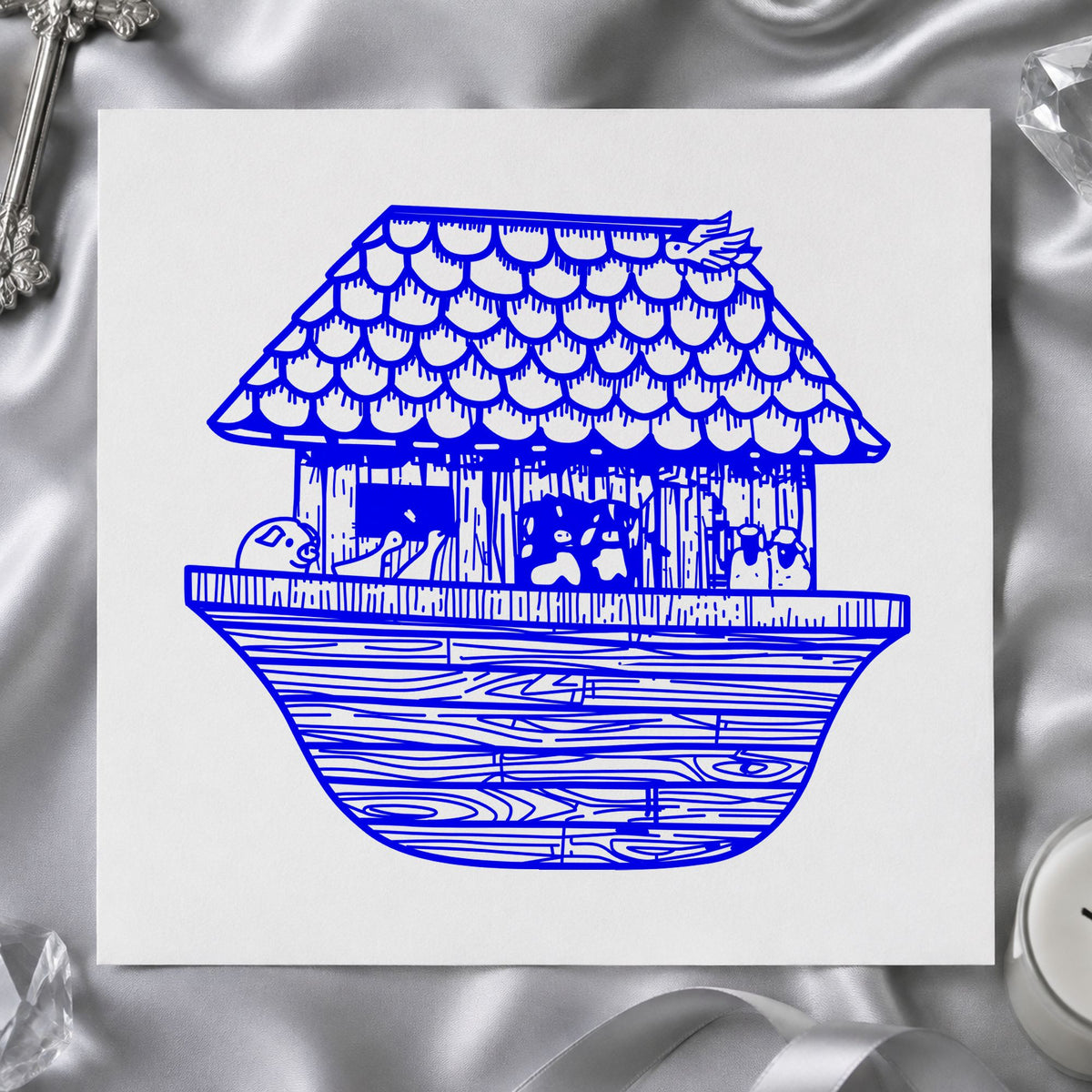 Blue animal ark craft stamp impression featuring the noah's ark wide design on white paper.