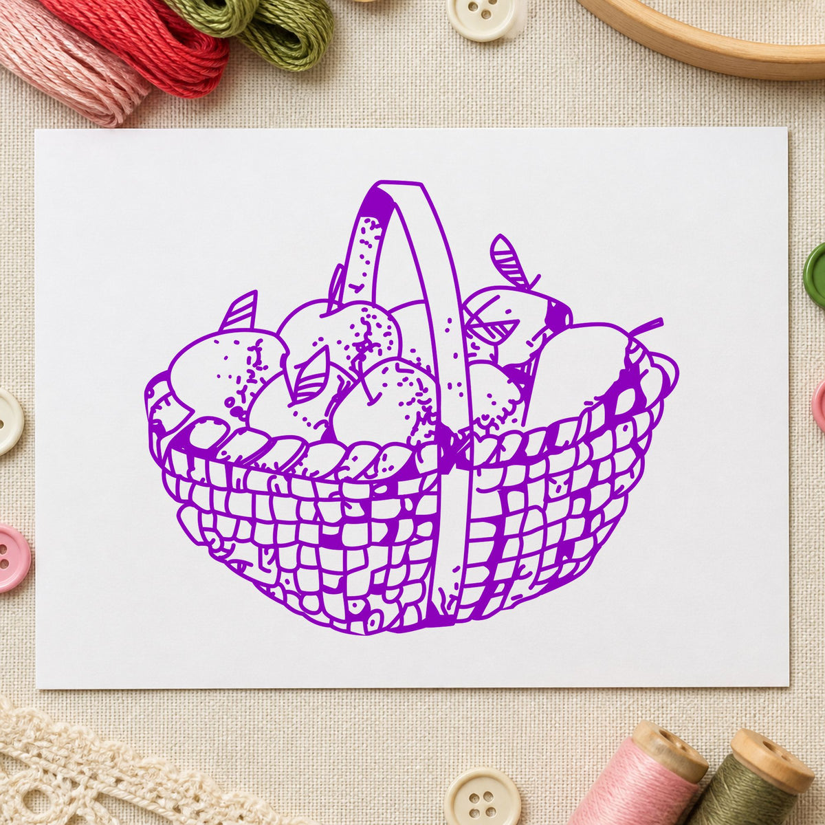 Round Apple Basket Rubber Stamp impression in purple ink on white paper in a styled craft setting.