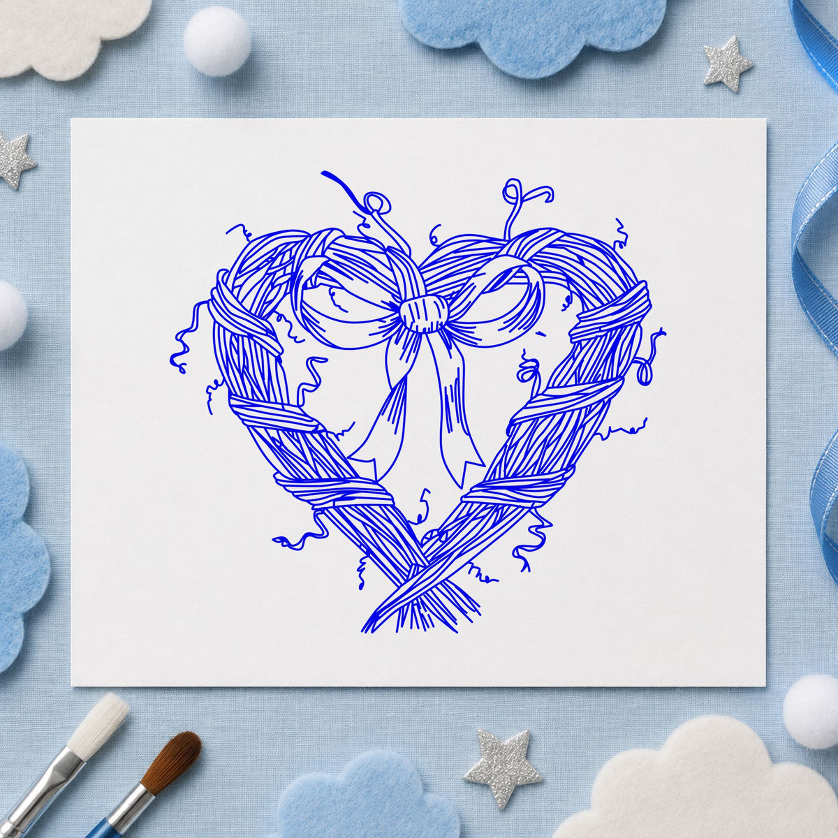 Blue valentine craft stamp impression featuring the heart wreath with bow design on white paper.