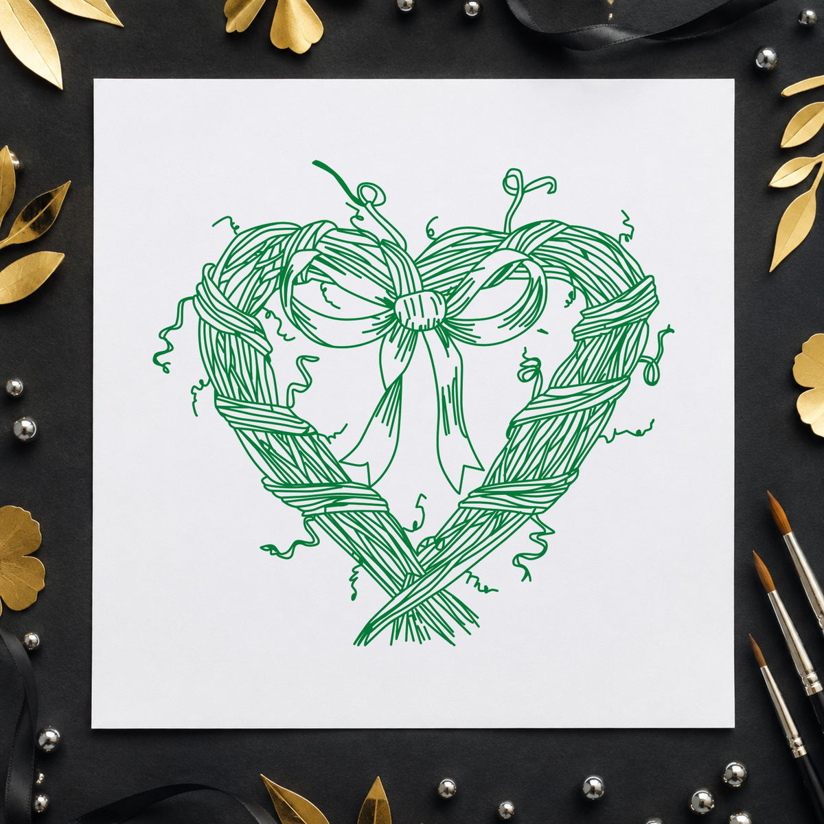 Heart Wreath with Bow Rubber Stamp impression in green ink on white paper in a styled craft setting.
