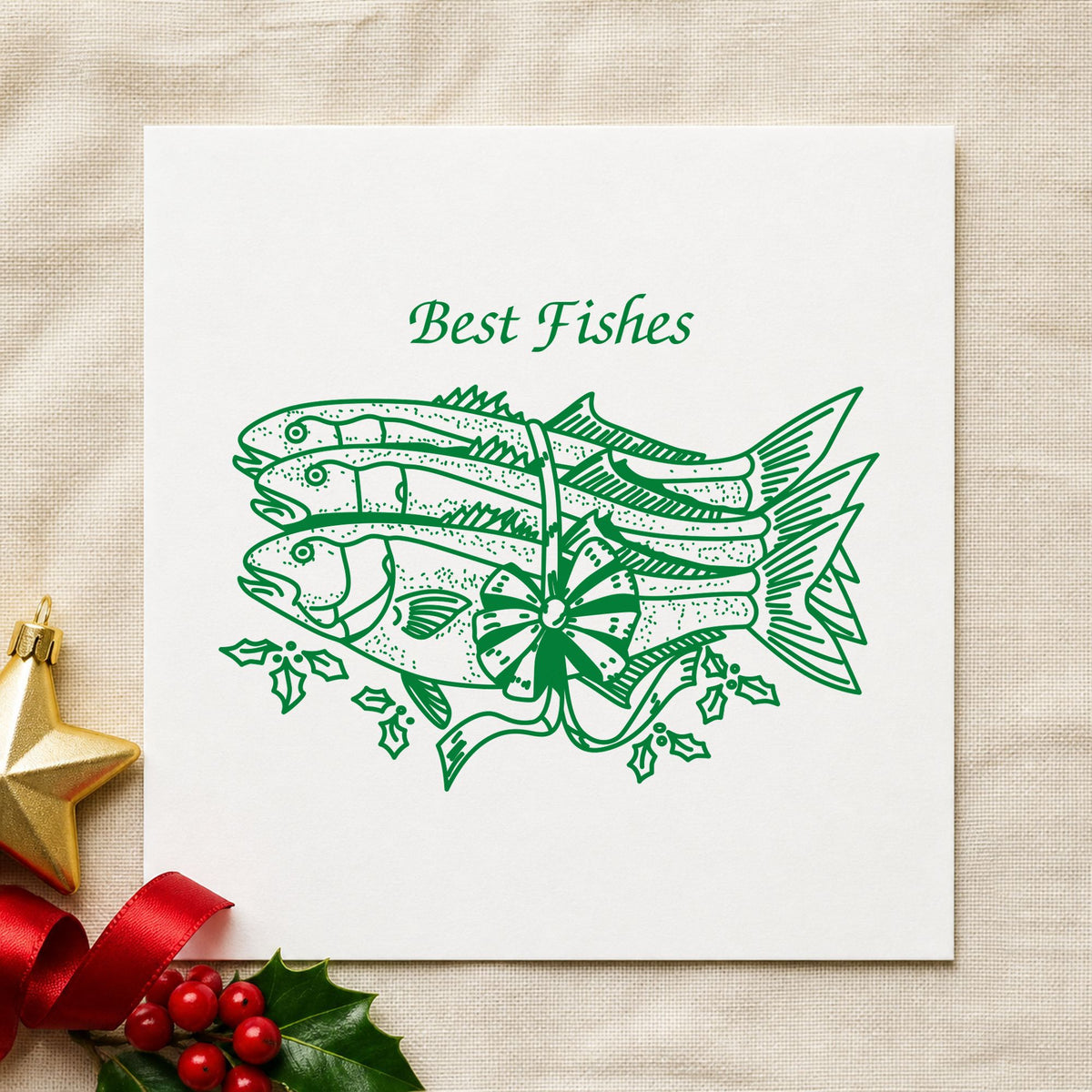 Best Fishes with Poinsettias Rubber Stamp impression in green ink on white paper in a styled craft setting.
