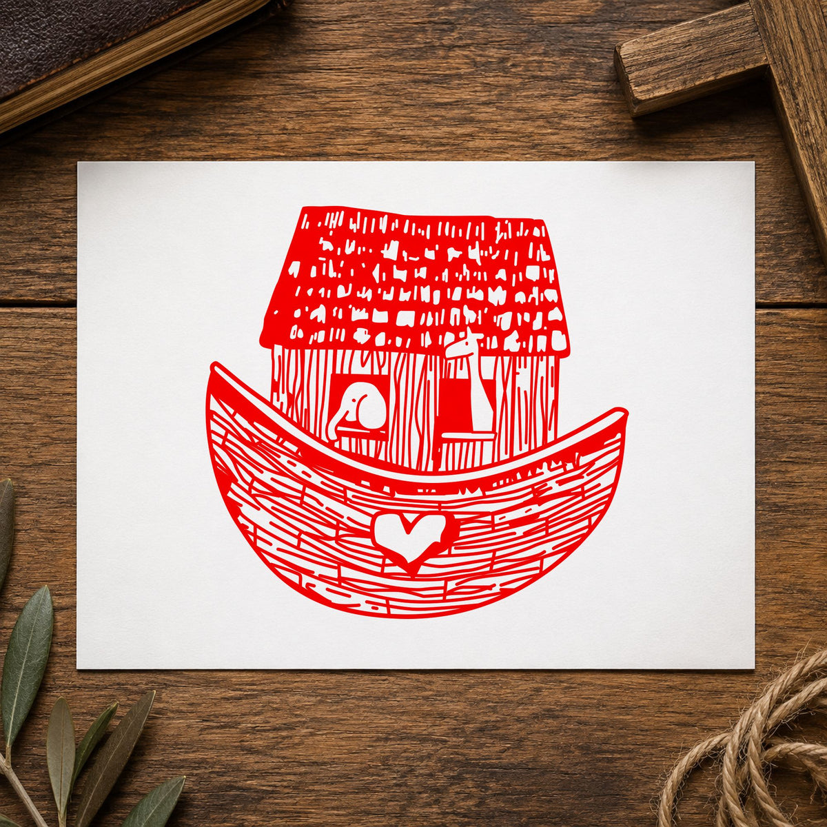 Square Noah's Ark Rubber Stamp impression in red ink on white paper in a styled craft setting.