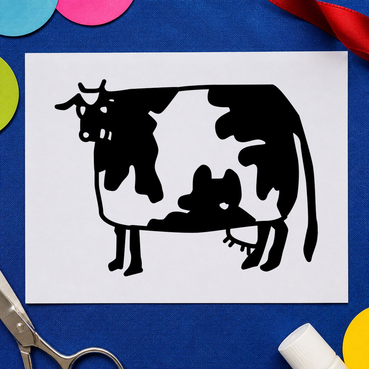 Folk Art Cow Rubber Stamp impression in black ink on white paper in a styled craft setting.