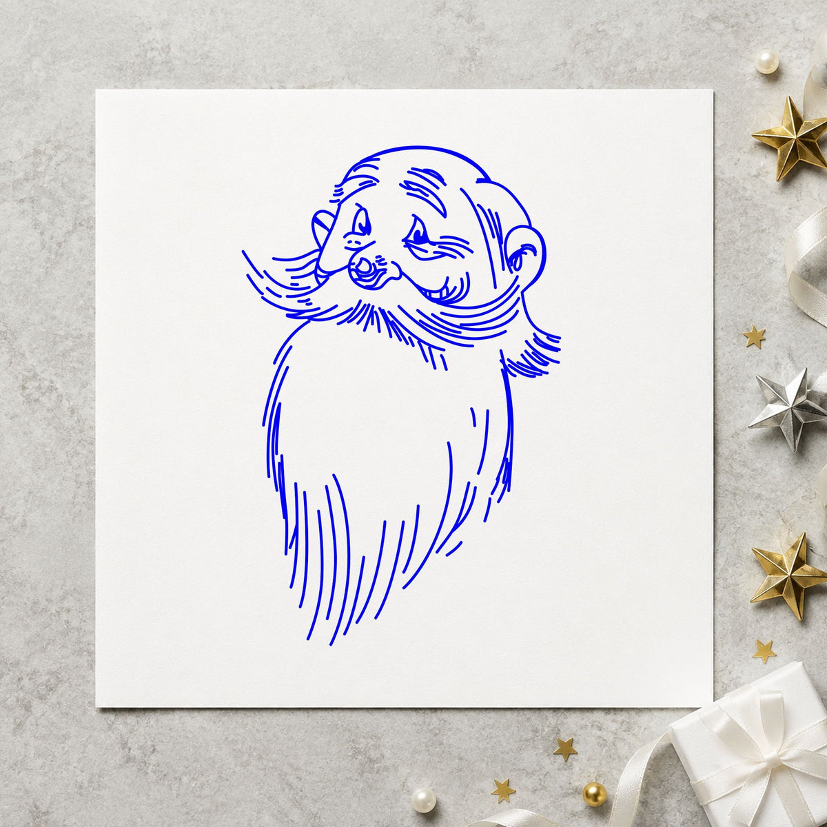 Blue christmas gift tag stamp impression featuring the santa claus face design on white paper.