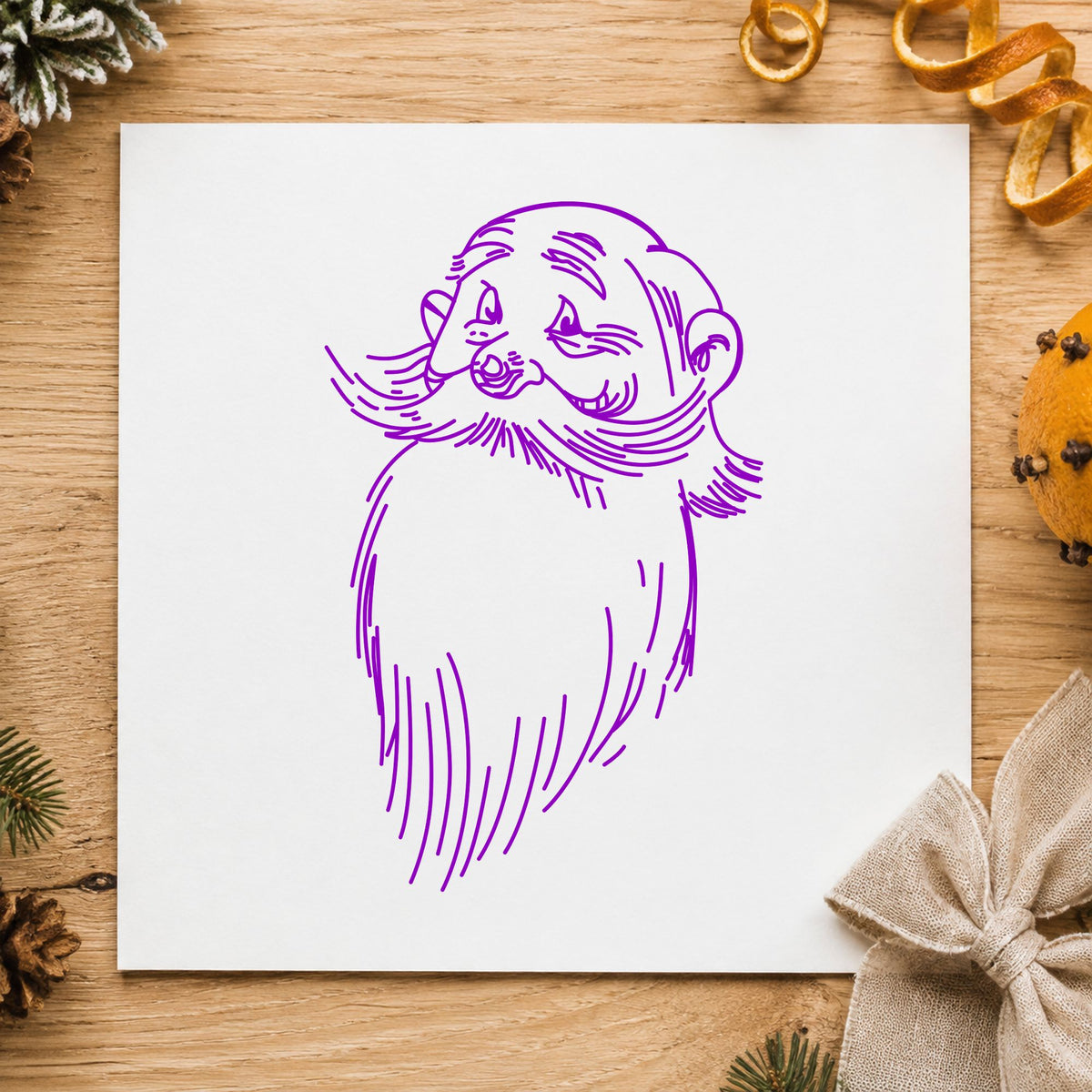 Santa Claus Face Rubber Stamp impression in purple ink on white paper in a styled craft setting.