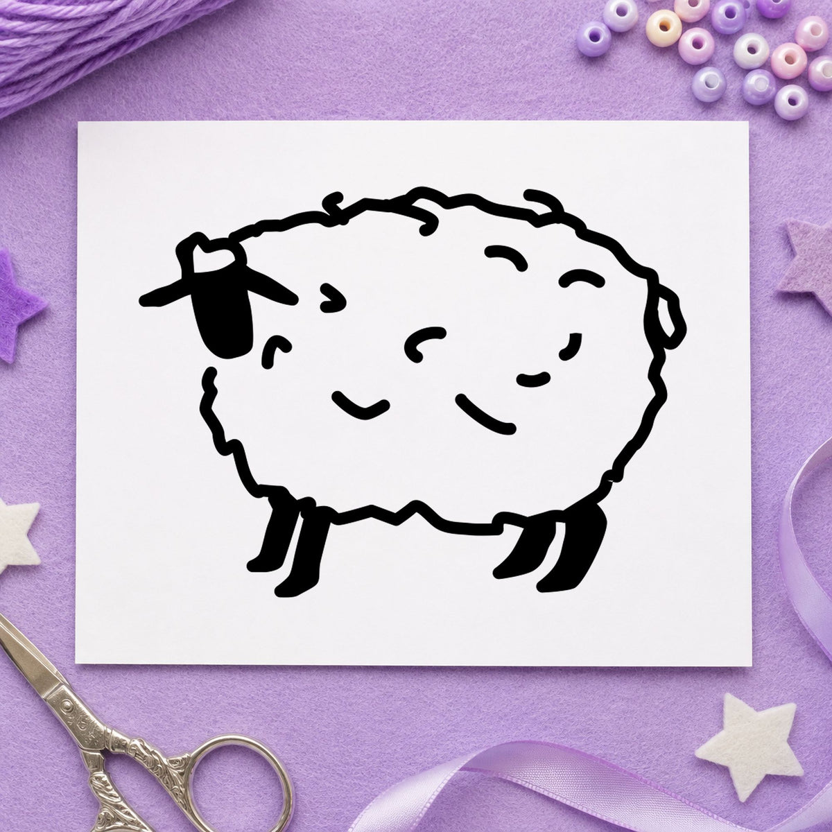 Folk Art Sheep Rubber Stamp impression in black ink on white paper in a styled craft setting.