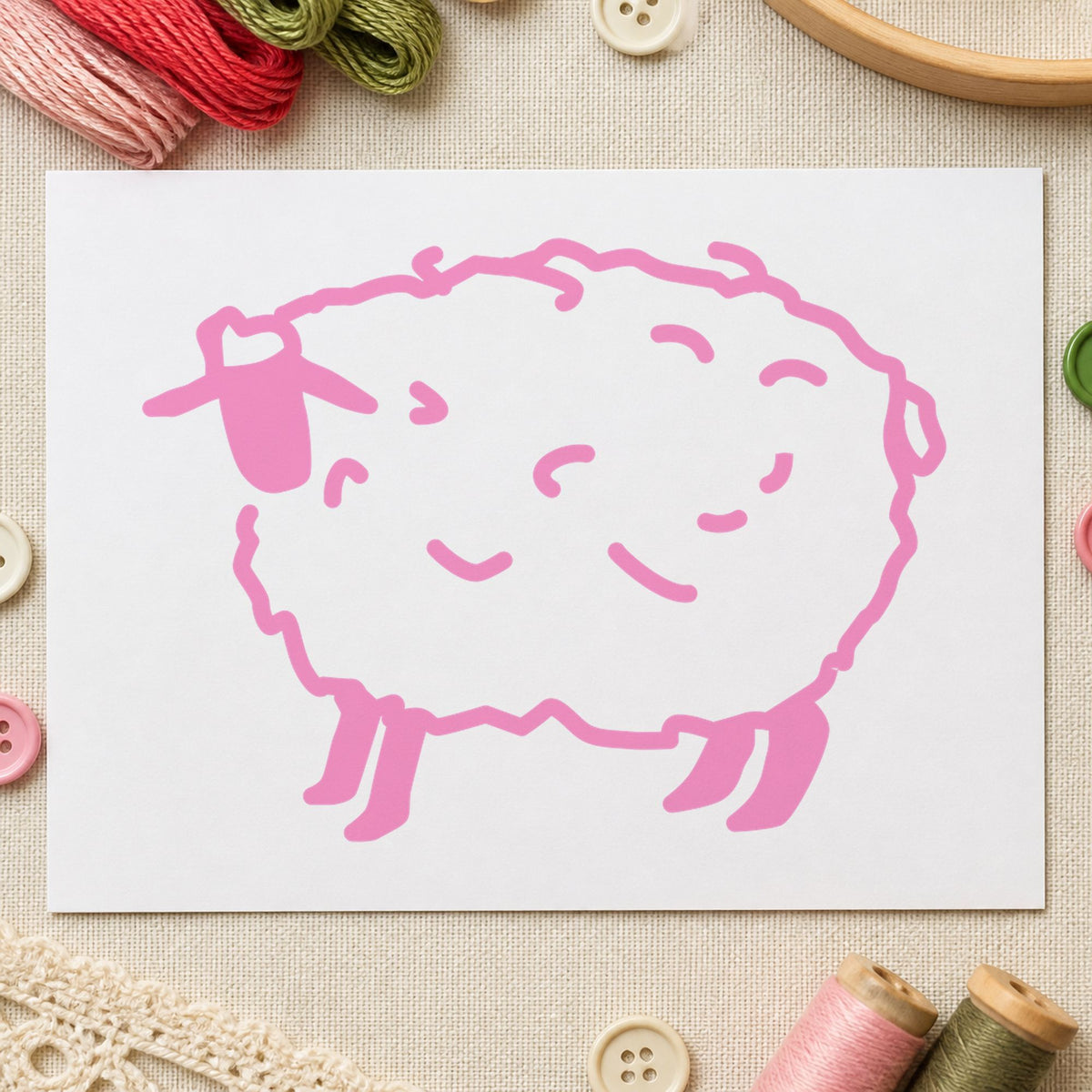 Folk Art Sheep Rubber Stamp impression in pink ink on white paper in a styled craft setting.
