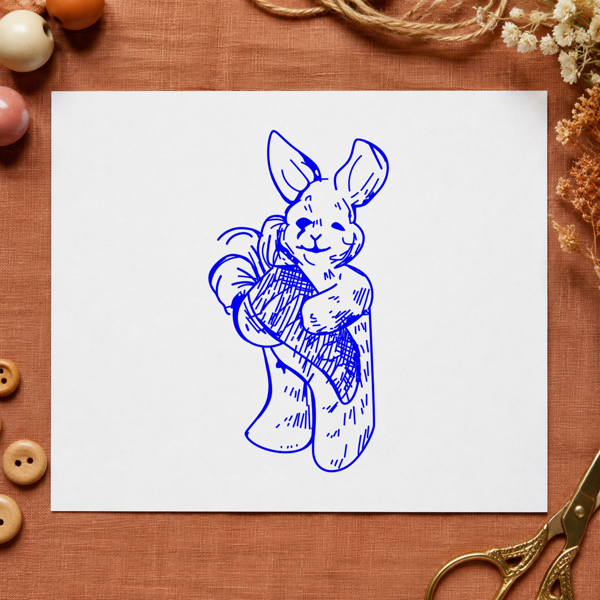 Blue valentine craft stamp impression featuring the girl with bow and arrow design on white paper.