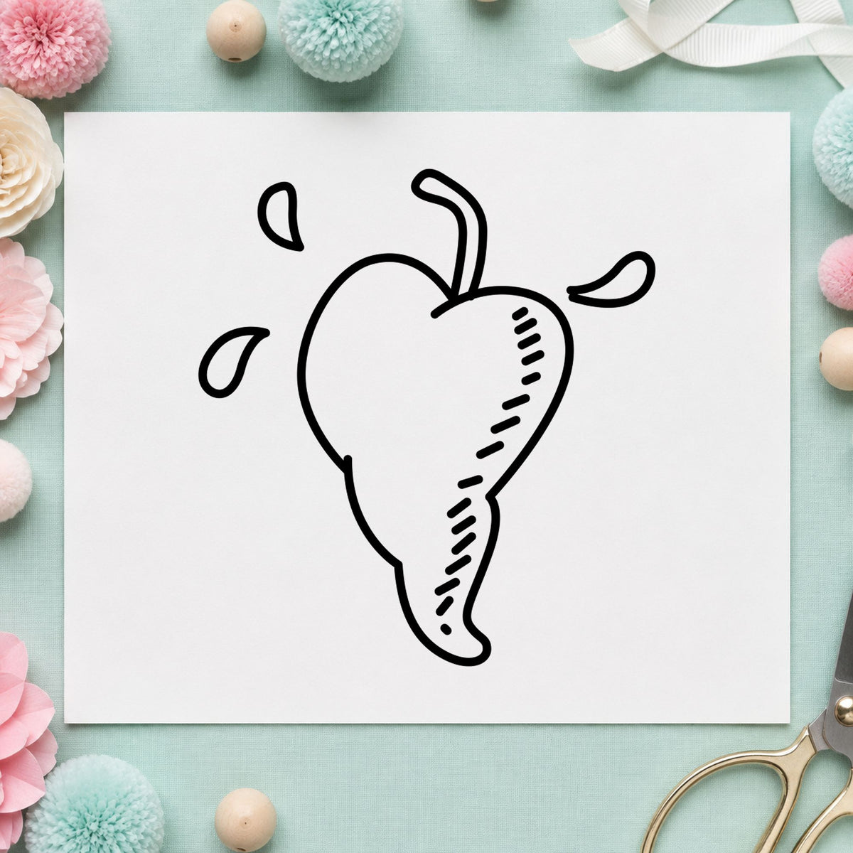 Heart-shaped Pepper Rubber Stamp impression in black ink on white paper in a styled craft setting.