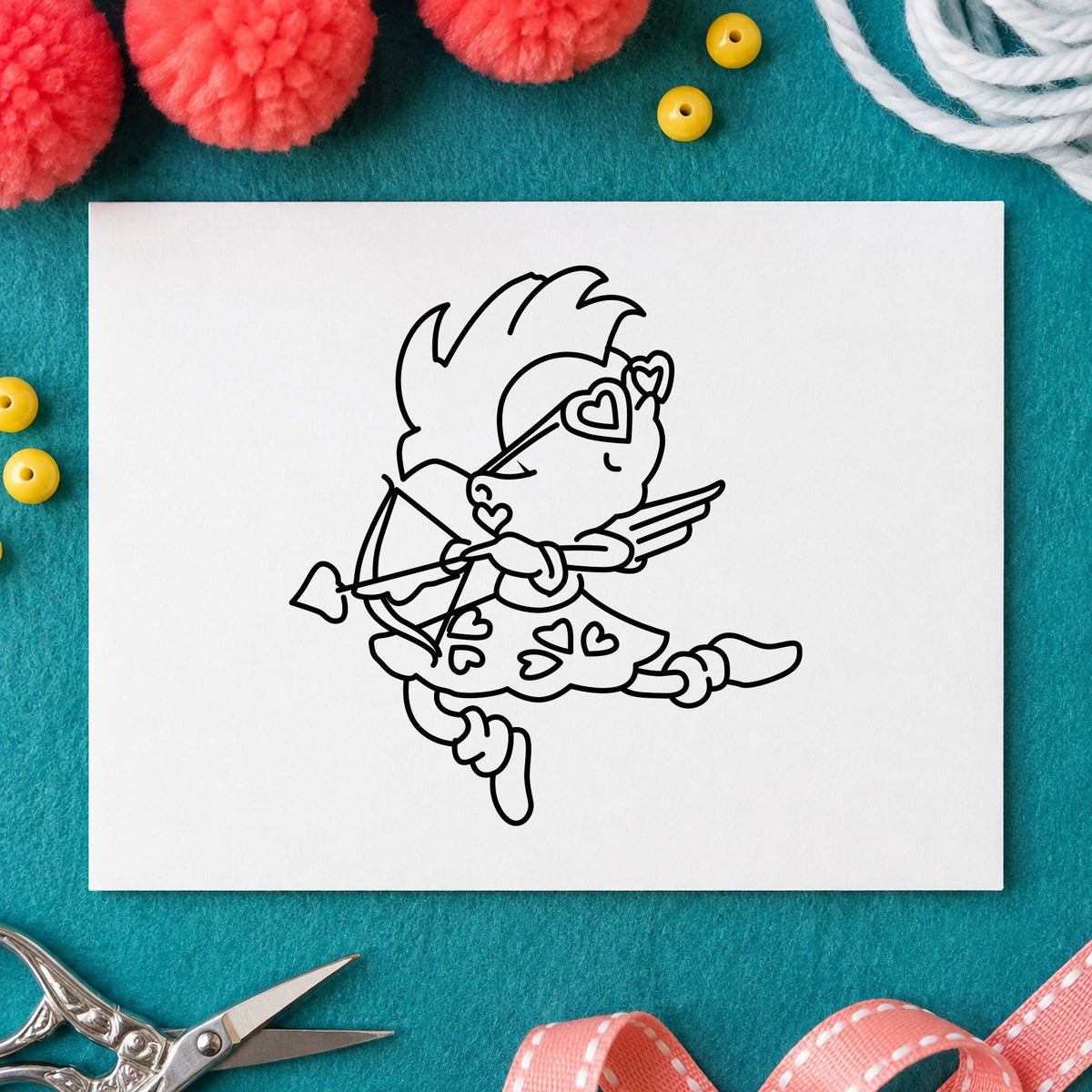 Black impression from a cupid rubber stamp, featuring the cupid with heart sunglasses design on white paper.