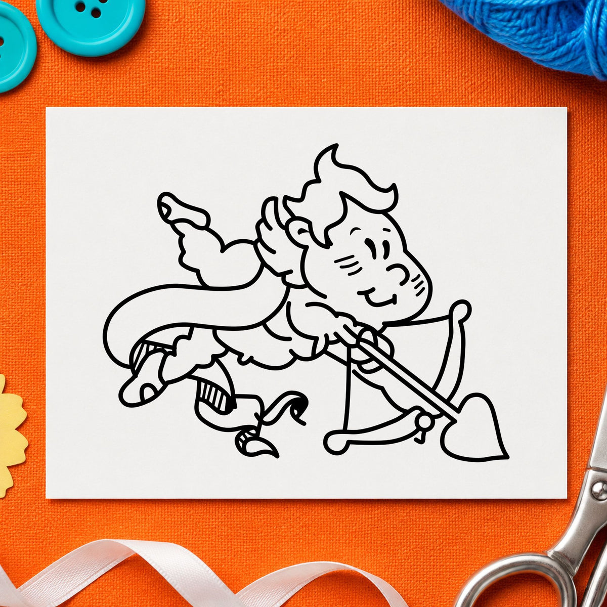 Cupid Shooting Heart Arrow Rubber Stamp impression in black ink on white paper in a styled craft setting.