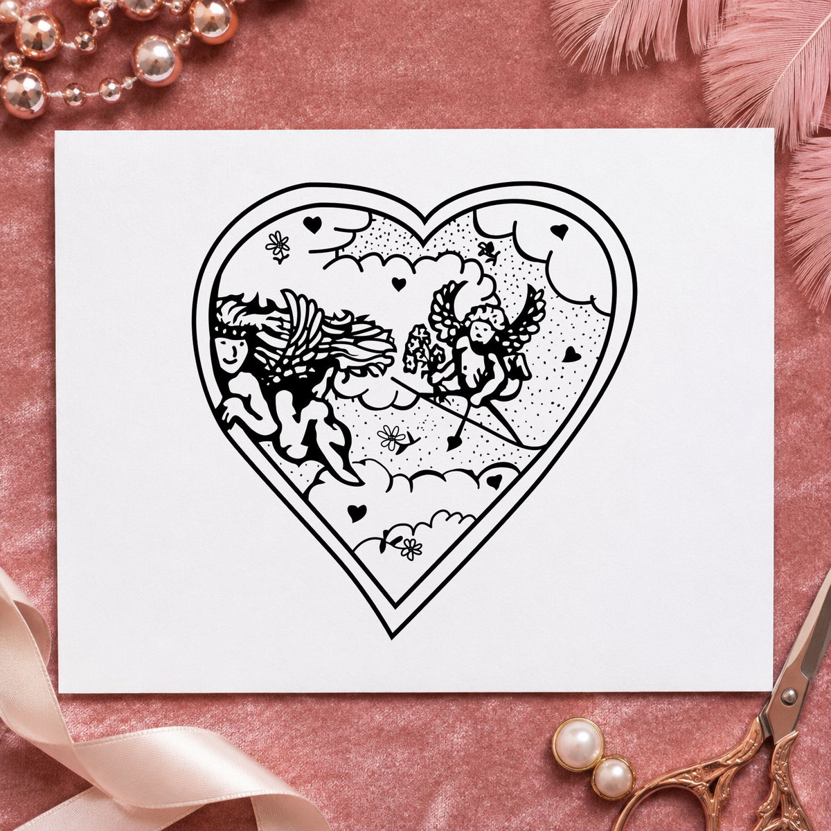 Black impression from a cupid rubber stamp, featuring the heart with two cupids design on white paper.