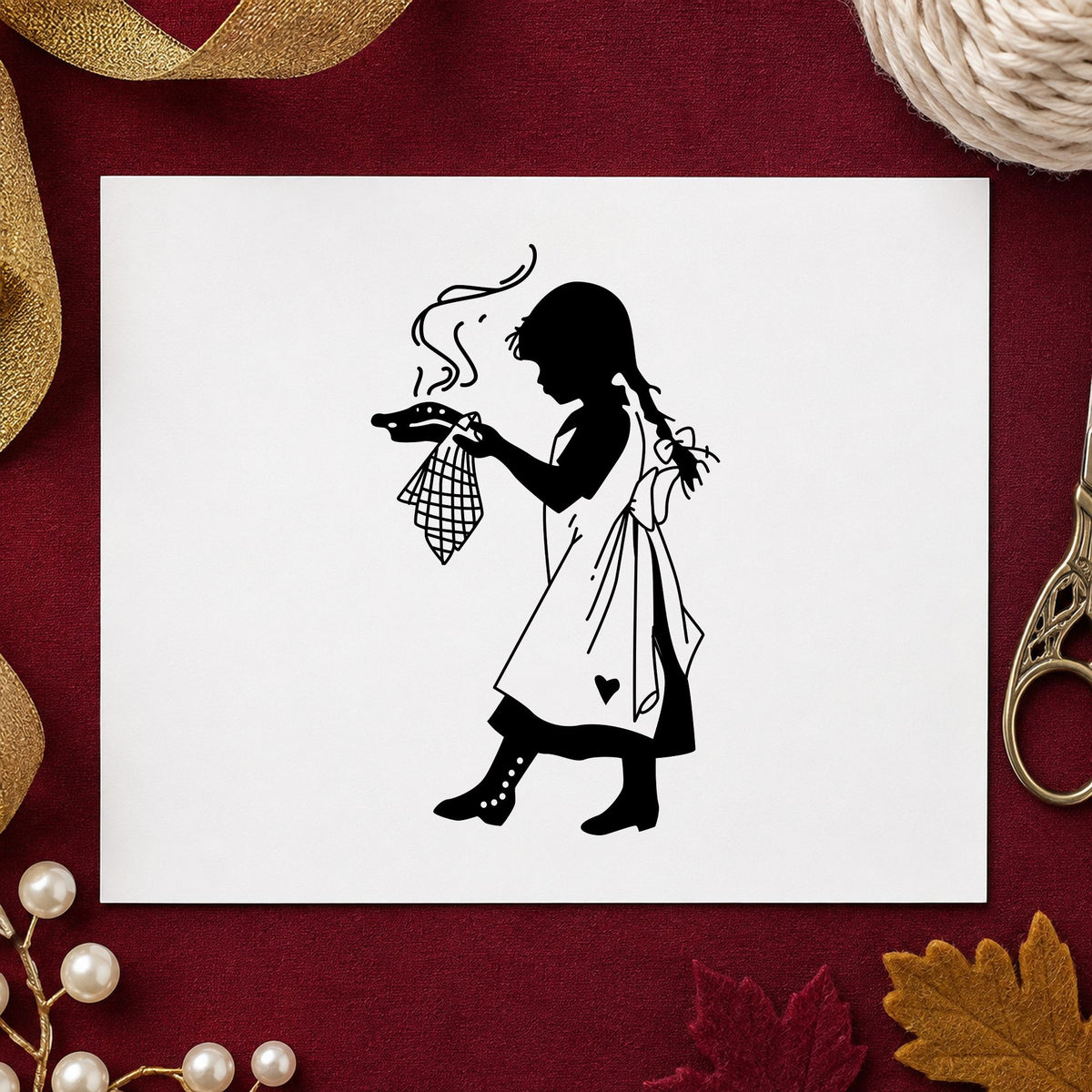 Black impression from a baking rubber stamp, featuring the girl serving pie design on white paper.