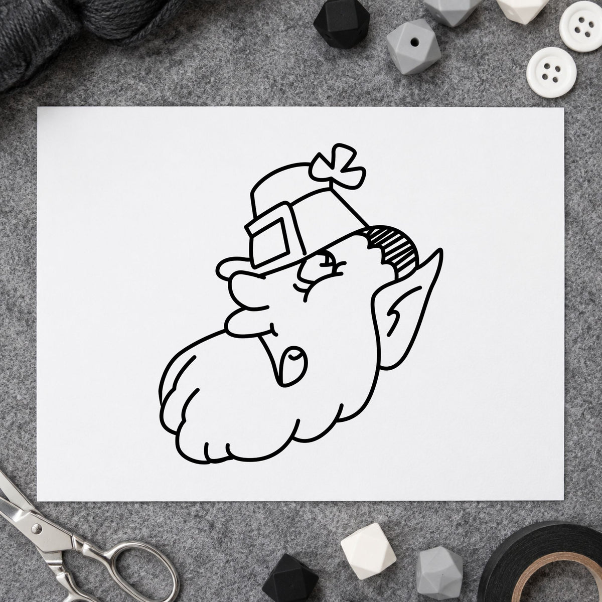 Black impression from a leprechaun face stamp, featuring the leprechaun head with shamrock hat design on white paper.