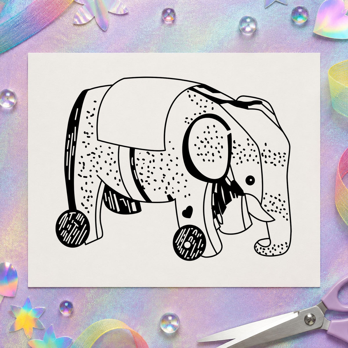 Black impression from a elephant rubber stamp, featuring the wheeled elephant toy design on white paper.