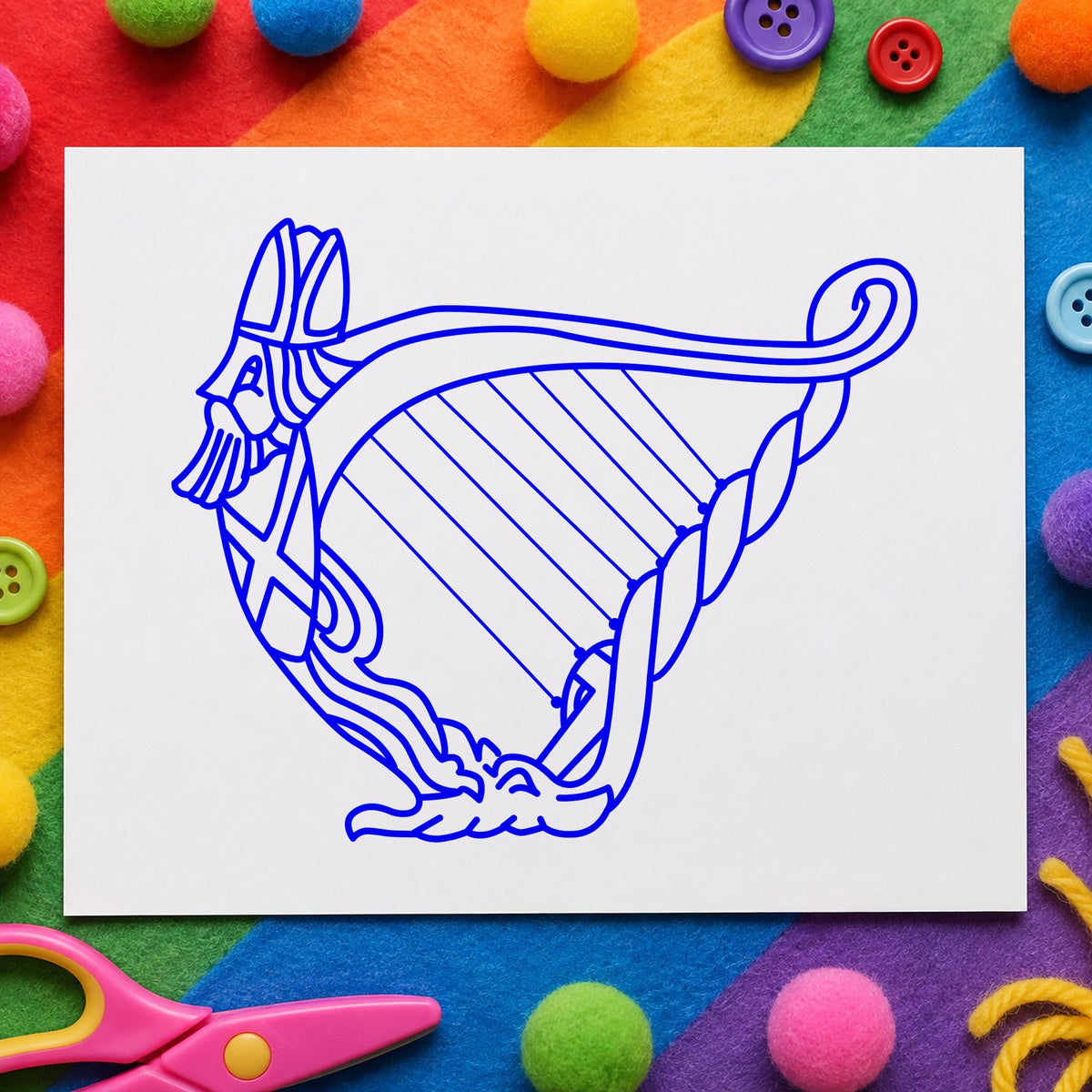 Decorative Harp Rubber Stamp impression in blue ink on white paper in a styled craft setting.