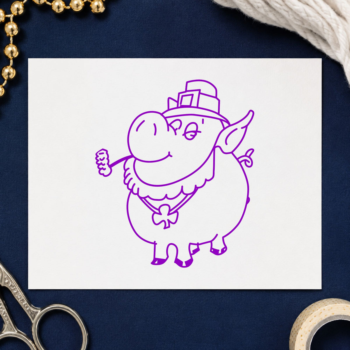 Irish Pig with Shamrock Rubber Stamp impression in purple ink on white paper in a styled craft setting.