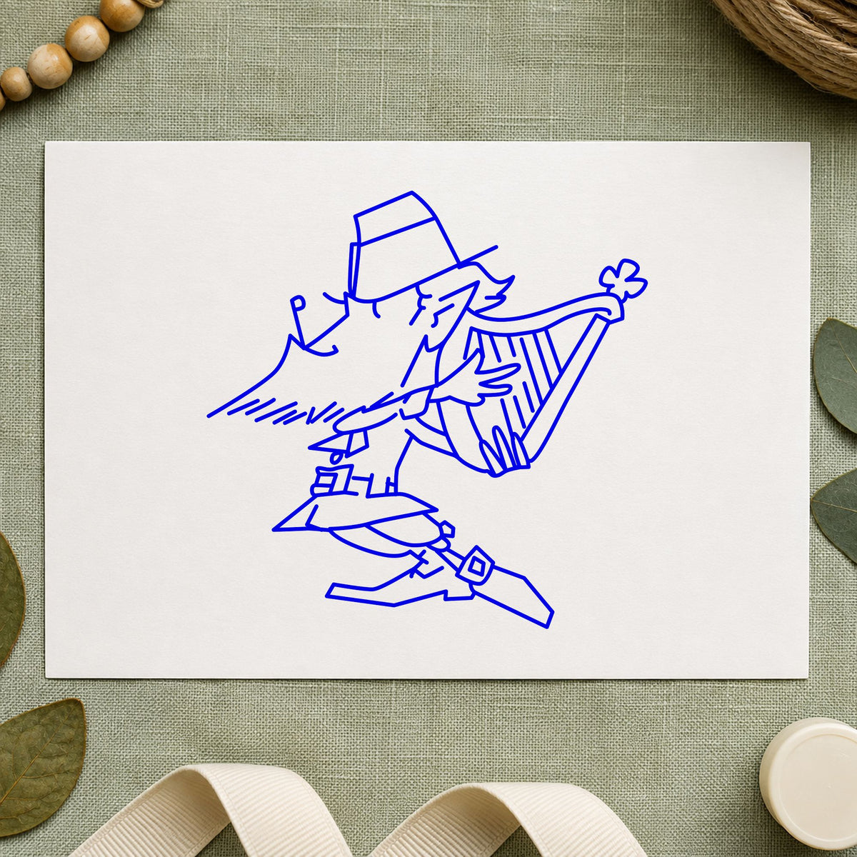 Blue irish music stamp impression featuring the leprechaun playing harp design on white paper.