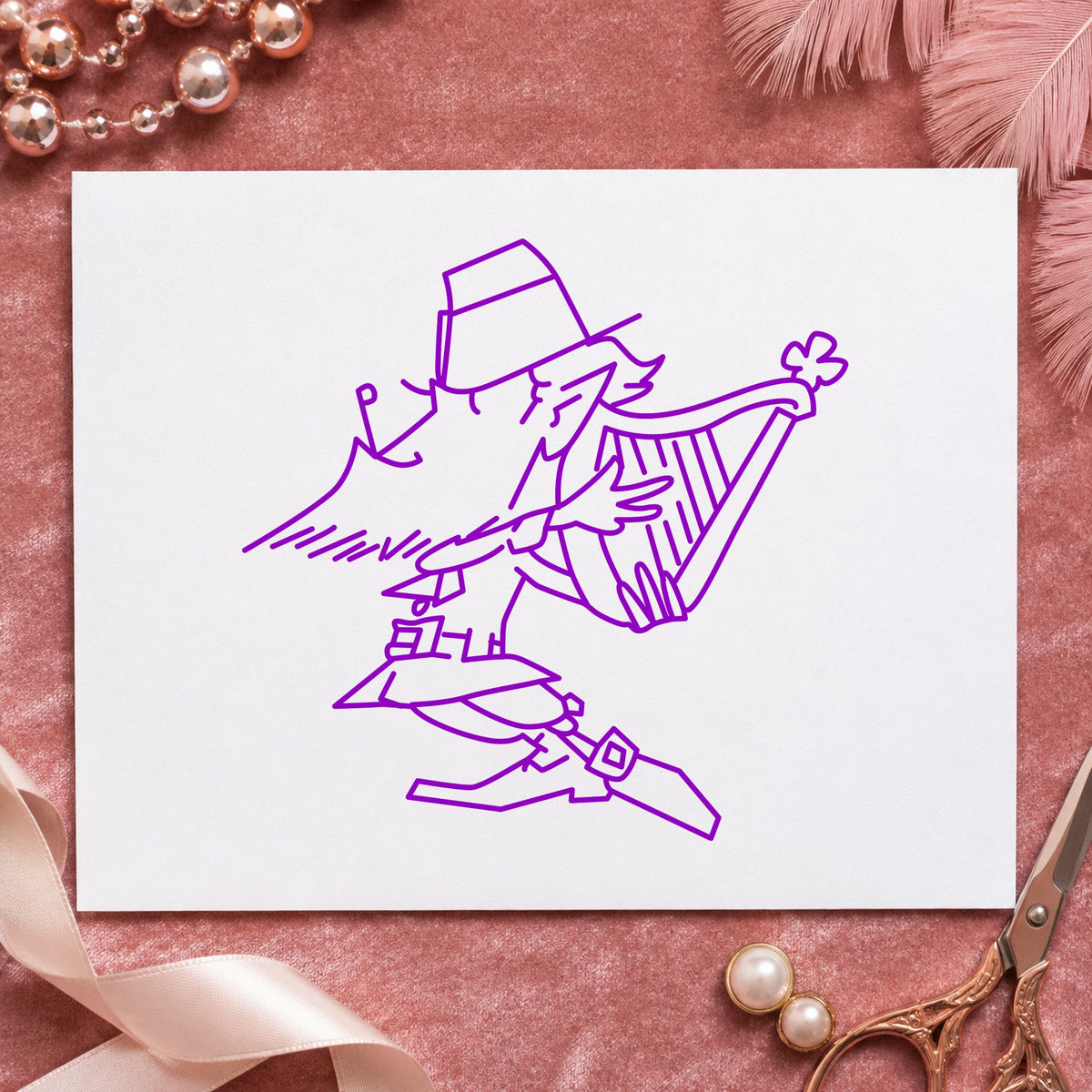 Leprechaun Playing Harp Rubber Stamp impression in purple ink on white paper in a styled craft setting.