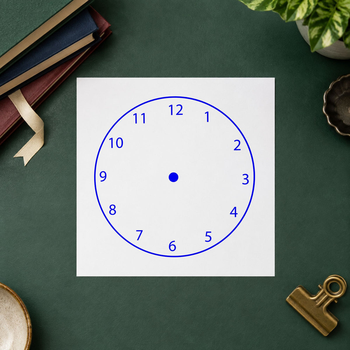 Blank Clock Face Rubber Stamp impression in blue ink on white paper in a styled craft setting.