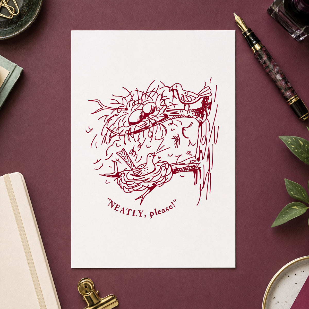 Neatly Please Birds Rubber Stamp impression in burgundy ink on white paper in a styled craft setting.