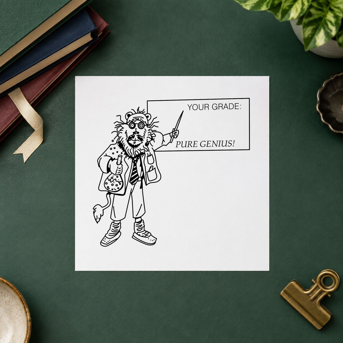 Your Grade Pure Genius Lion Rubber Stamp impression in black ink on white paper in a styled craft setting.