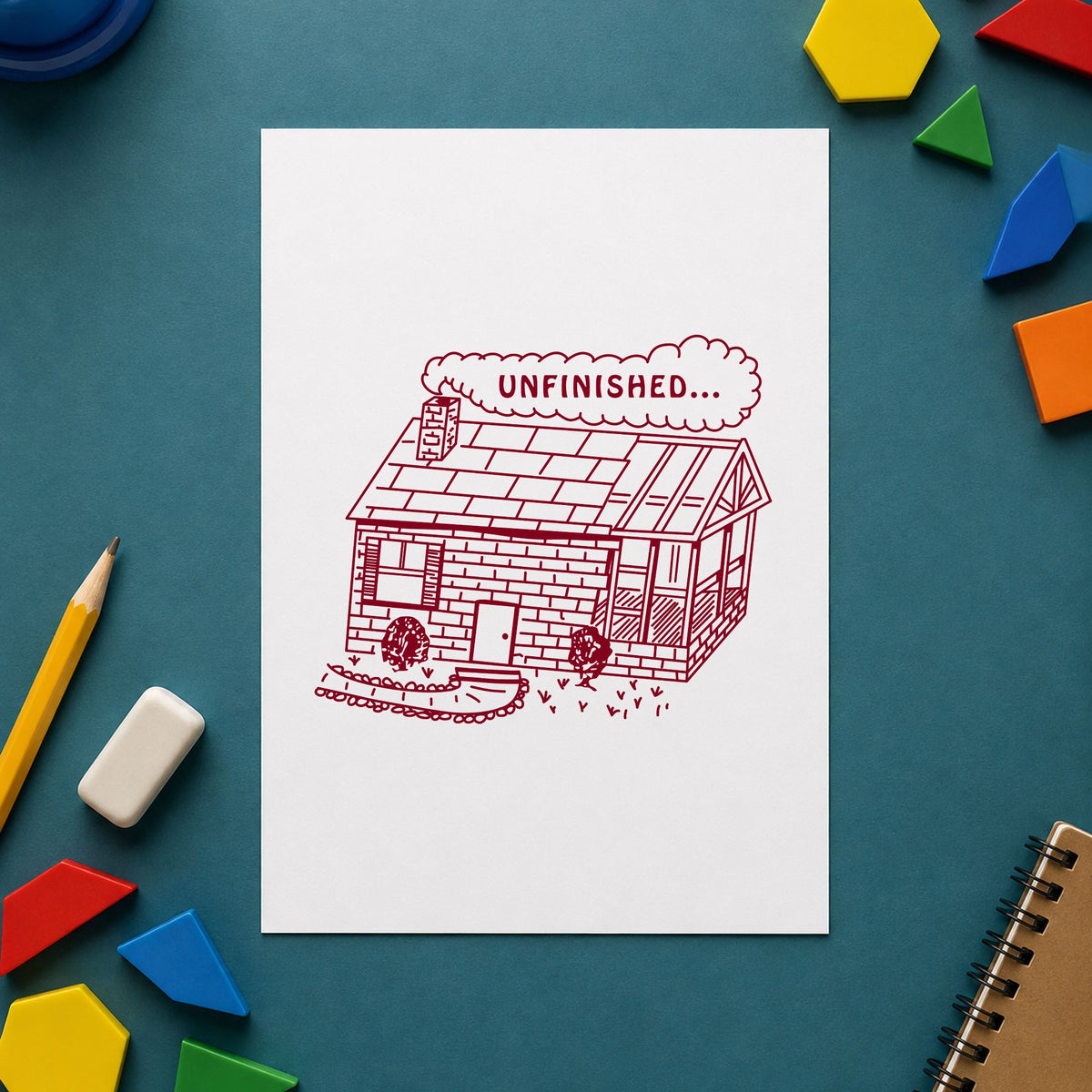 Unfinished Work Reminder Rubber Stamp impression in burgundy ink on white paper in a styled craft setting.